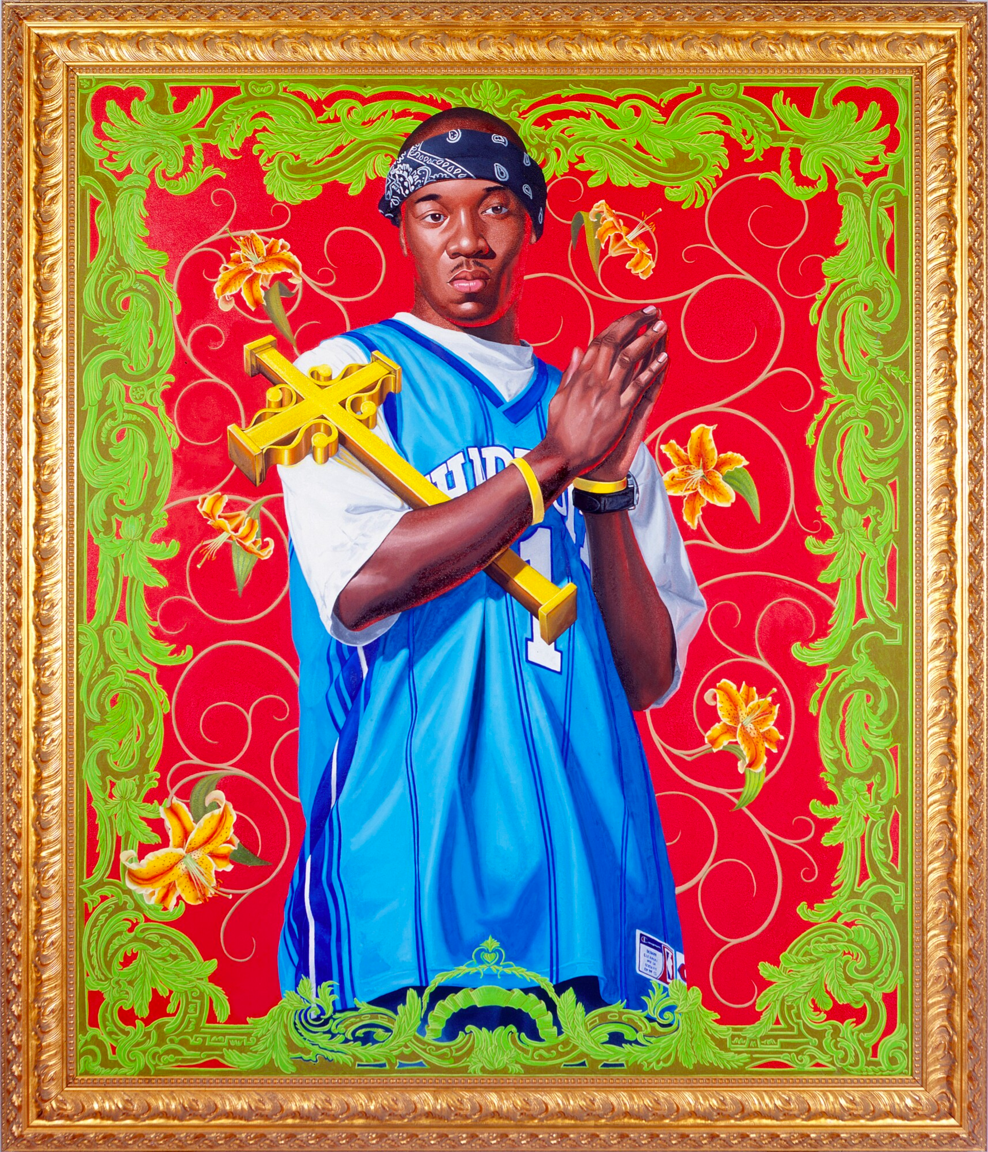 In the center of the portrait, a young black man captures attention with his street-style ensemble. He wears a white t-shirt beneath a blue basketball sports jersey, and a blue paisley bandana adorns his head. His gaze locks onto the viewer as he assumes a prayer pose, with his hands clasped in front of him. Against a vibrant red backdrop, adorned with yellow flowers, the young man stands out. The artwork is further enhanced by intricate and ornate vibrant green elements. The portrait is elegantly framed in gold.