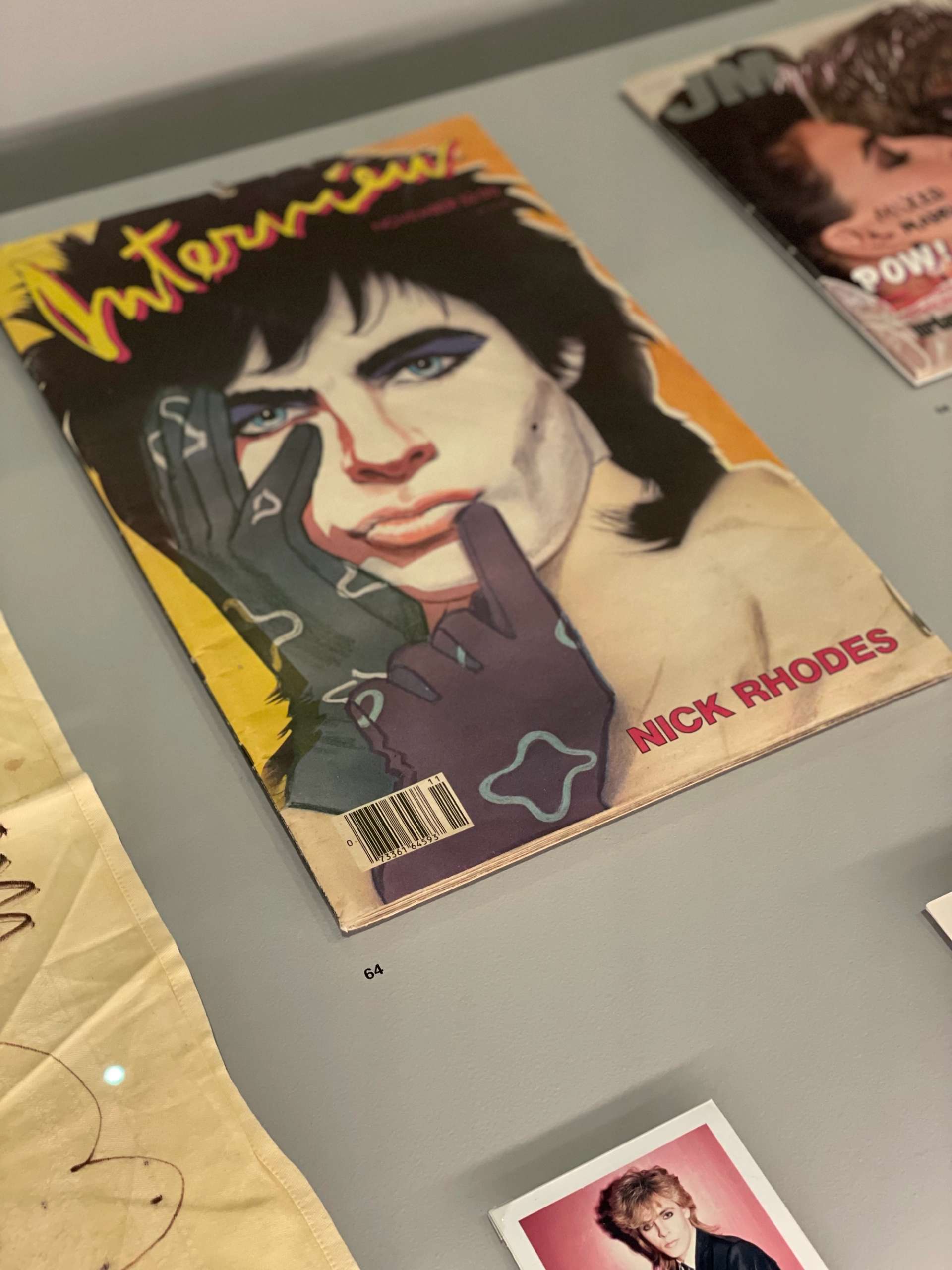 Close up of Andy Warhol's Interview magazine and other photographs