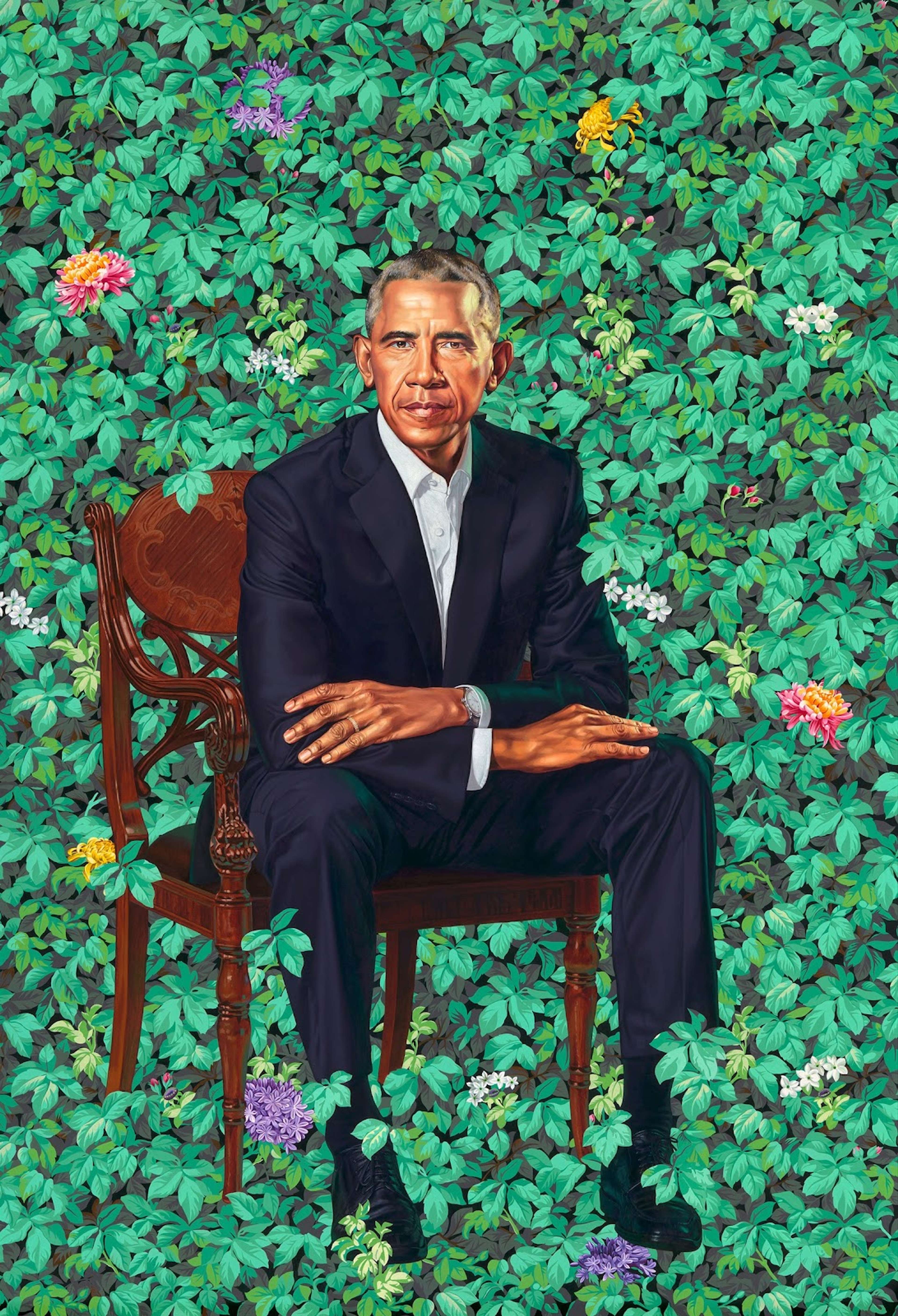 A large-scale portrait titled "Portrait of Barack Obama" by Kehinde Wiley, 2018, depicting the former US President seated in a chair against a backdrop of lush green foliage, wearing a suit and tie, with folded arms and a serious expression on his face.