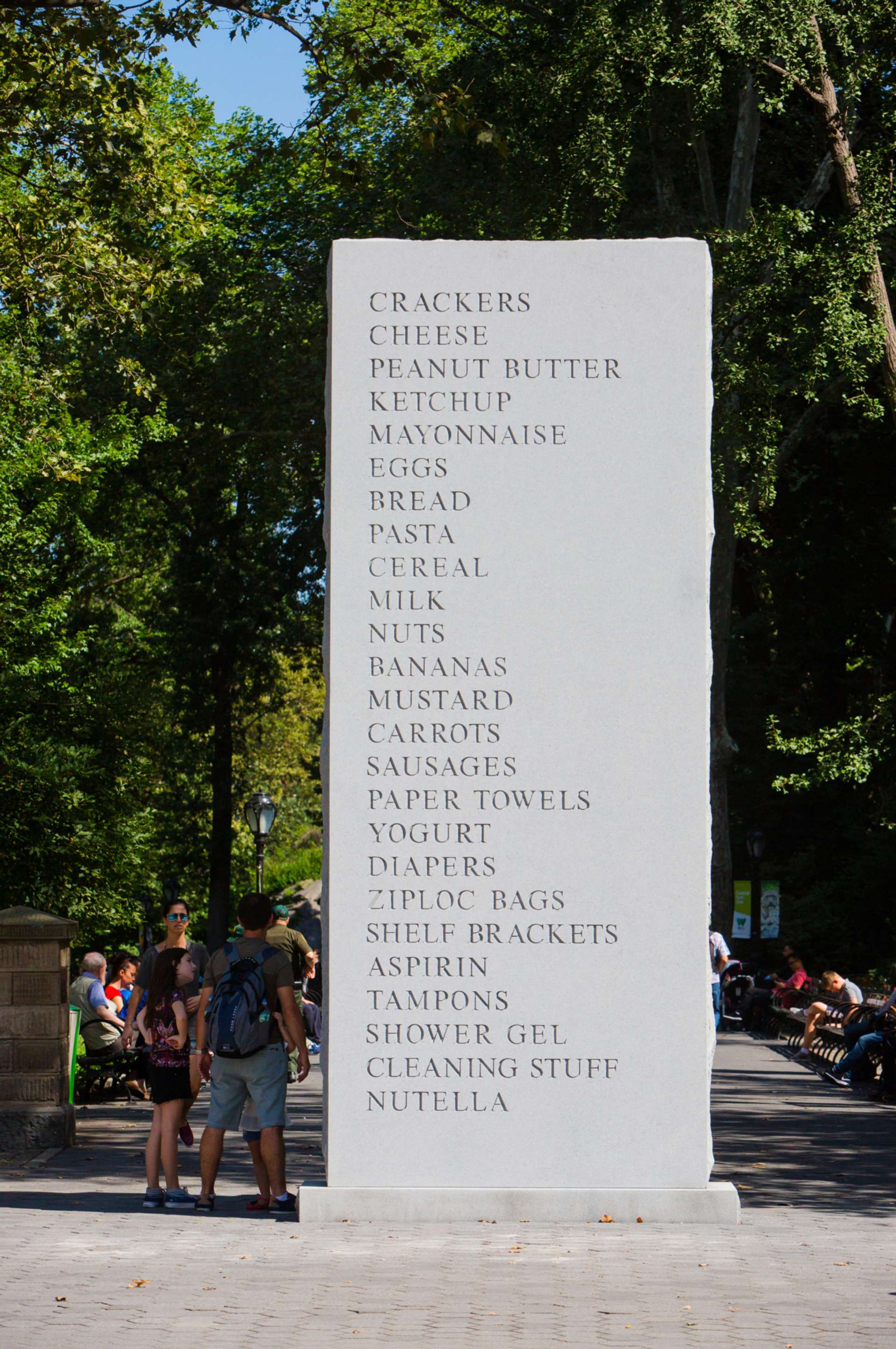 Vertical stone slab with various foods engraved into the stone
