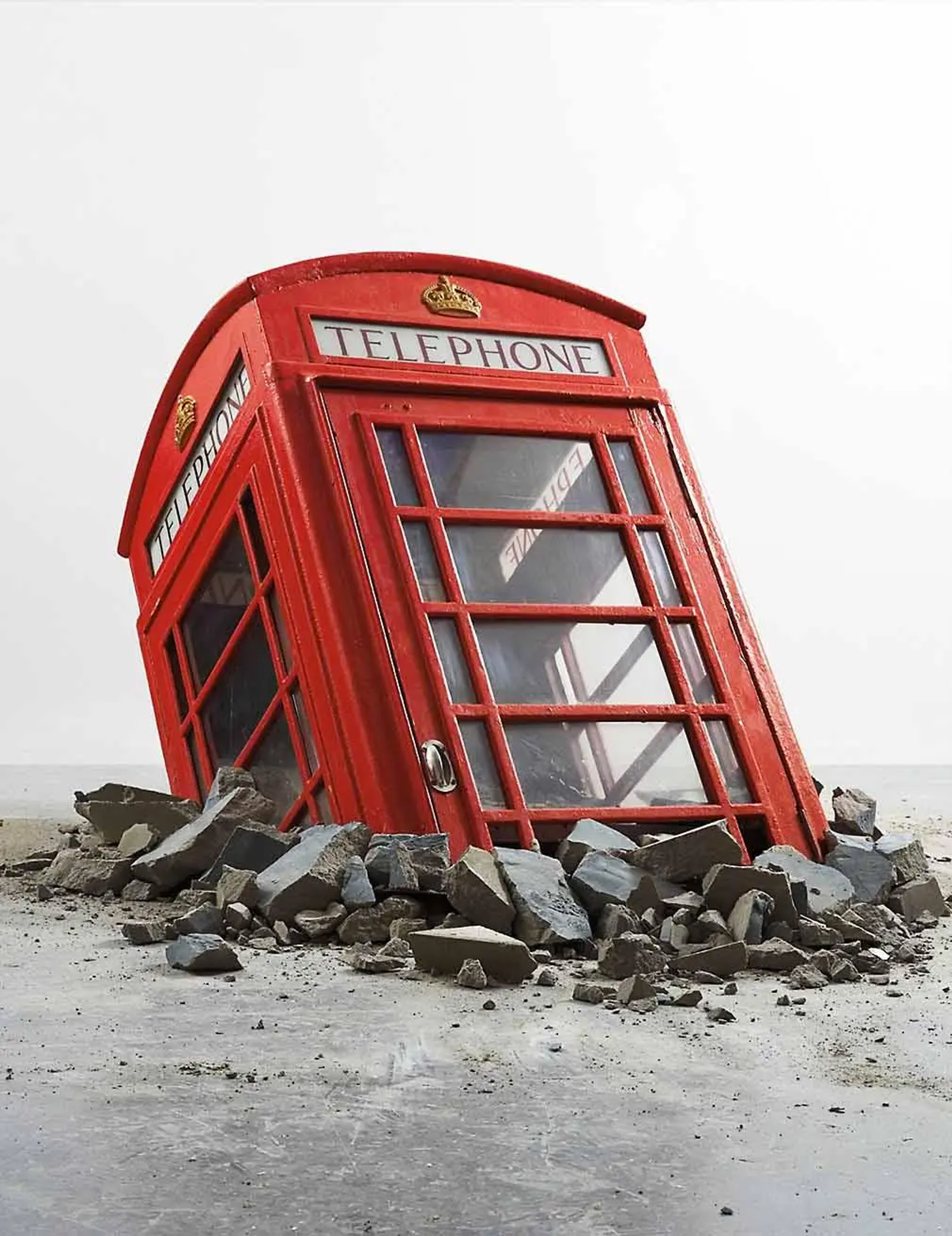 This mixed media installation captures the iconic British phone booth in a state of emergence or perhaps submergence, depending on one's perspective.