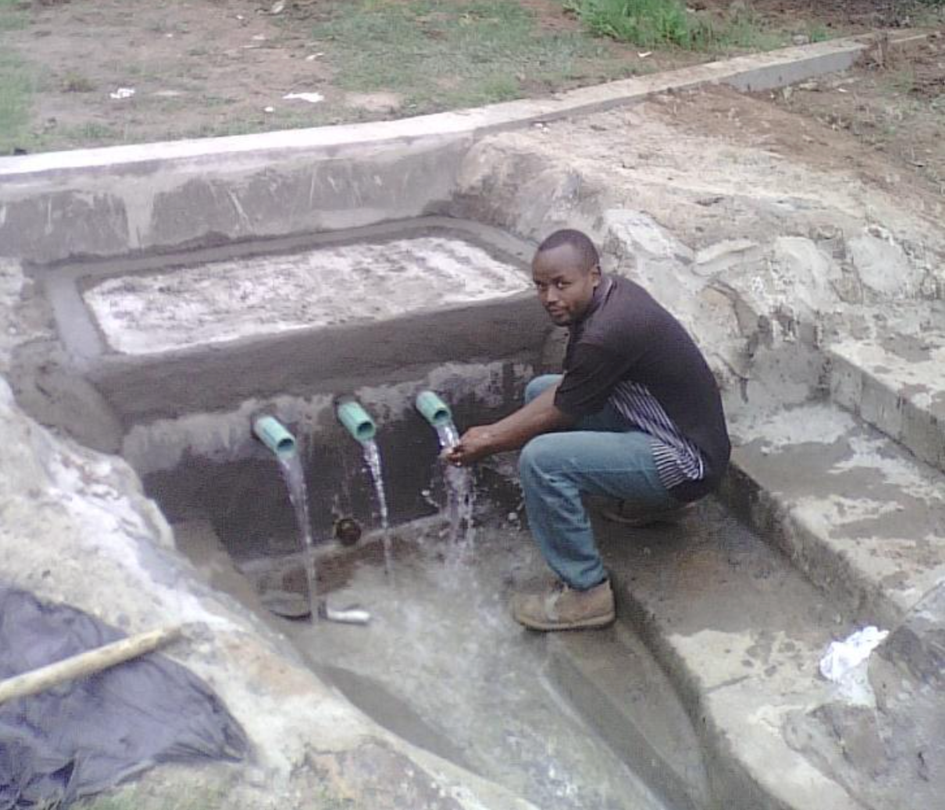 George had completed Primary school but then as his parents were dead he ended up on the streets. W.O.R.K. took him and after completing Secondary school and College qualified as a Civil Engineer. He has built Protected Springs (water springs) high up on Mt Elgon for very poor rural communities to have access to clean water.