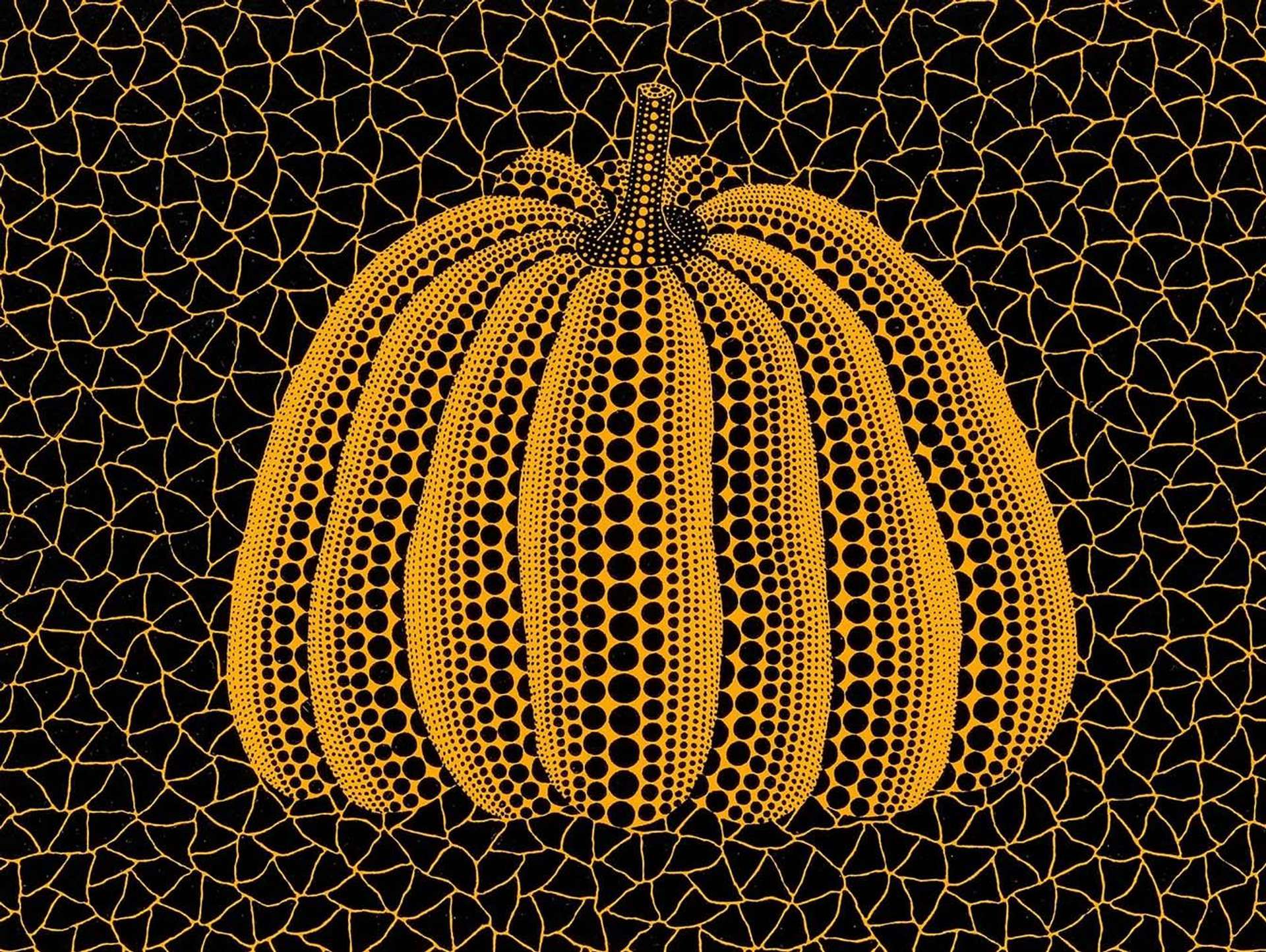 A graphic yellow pumpkin with black dots on a cracked black background