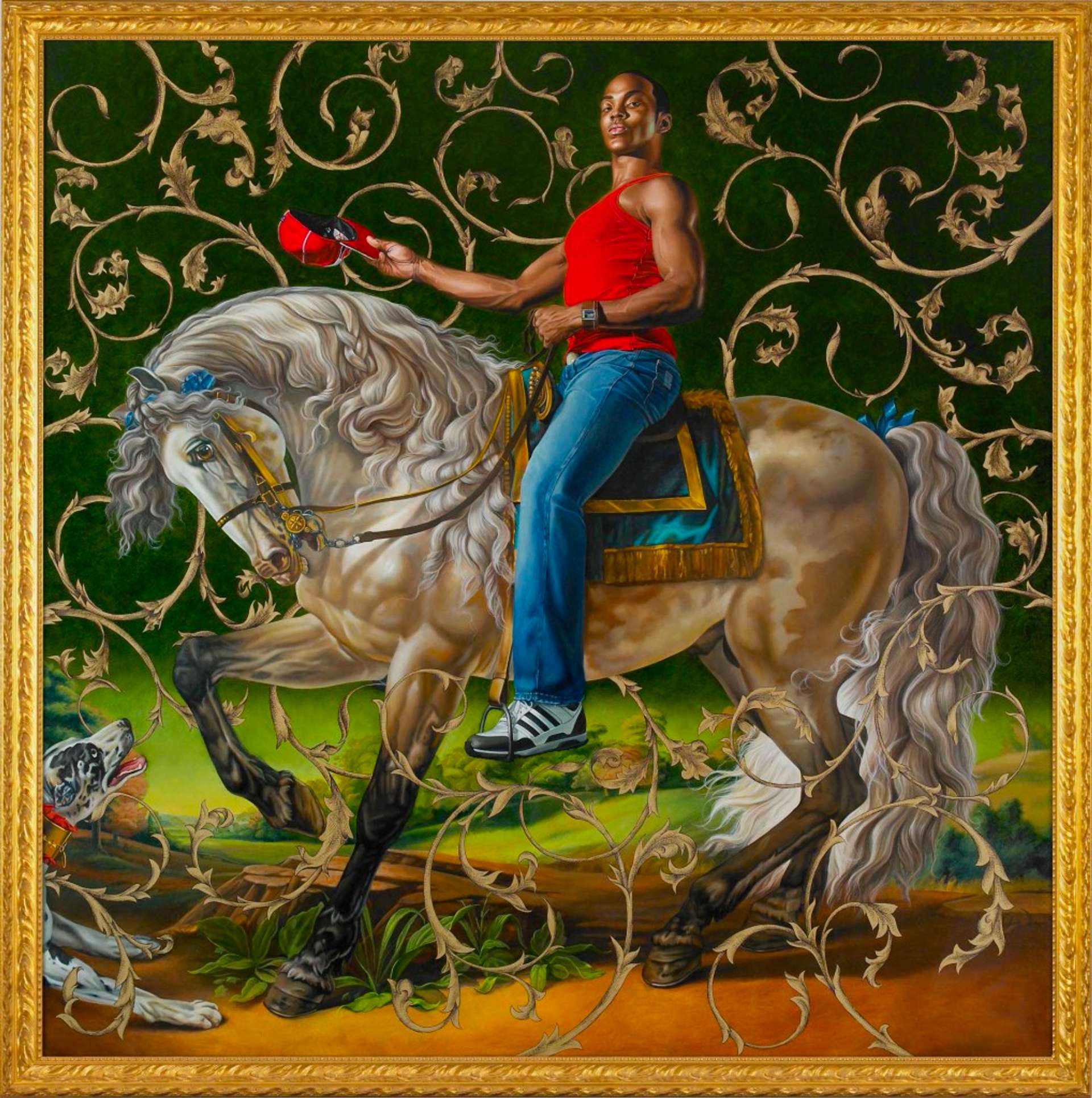 A young man sits on an immaculately groomed white and grey horse with its head bowed. The man sits on a silk saddle holding the reins, wearing a vest, jeans and trainers. In the other hand, he holds a baseball cap out in a regal pose.