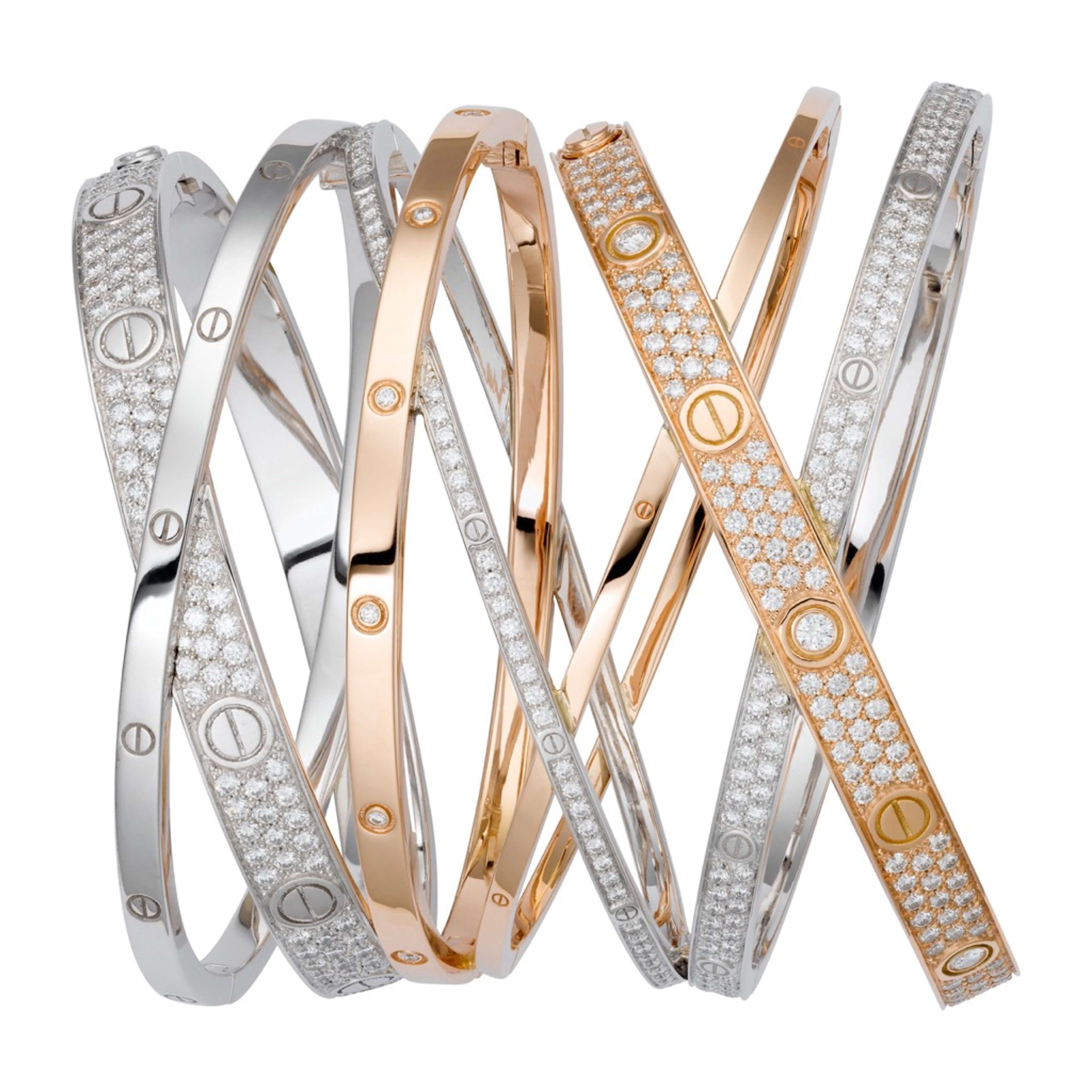 An image of several models of Cartier’s Love bracelets intertwined