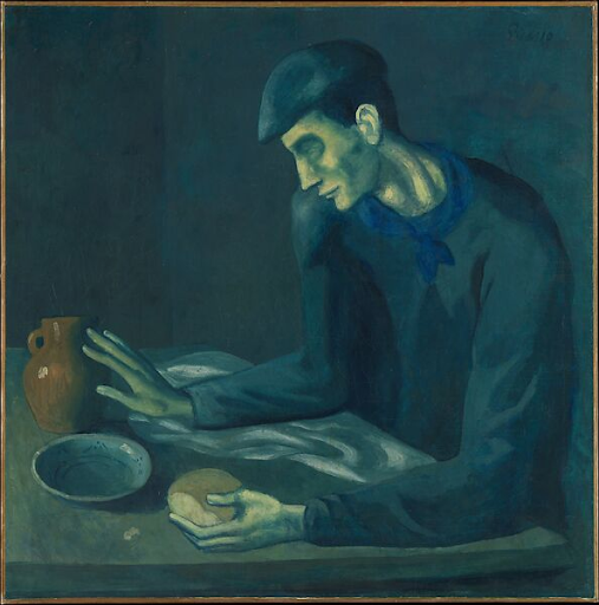 Pablo Picasso’s Le Repas De L’aveugle. A Blue Period painting of a man sitting alone at a dining table, holding a piece of bread, reaching for a pitcher, all with a blue overtone.