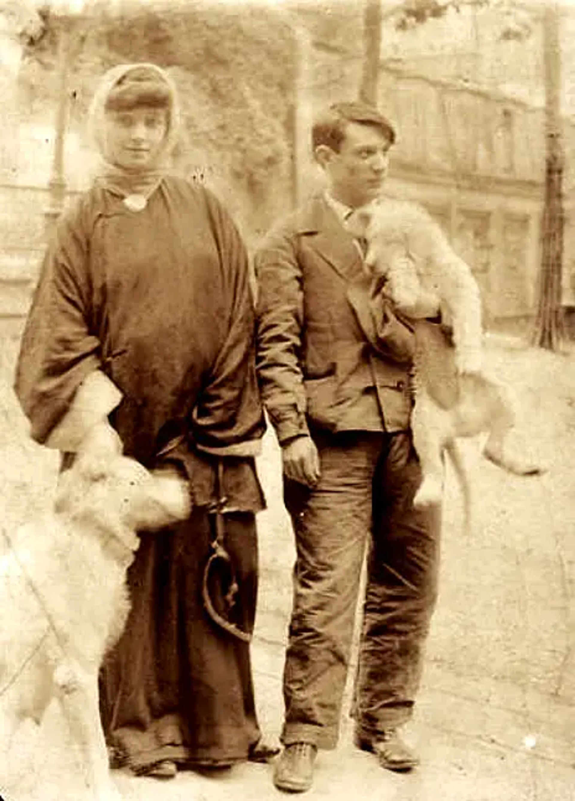 An old, sepia-tone image of the artist Pablo Picasso alongside his muse Fernande Olivier.