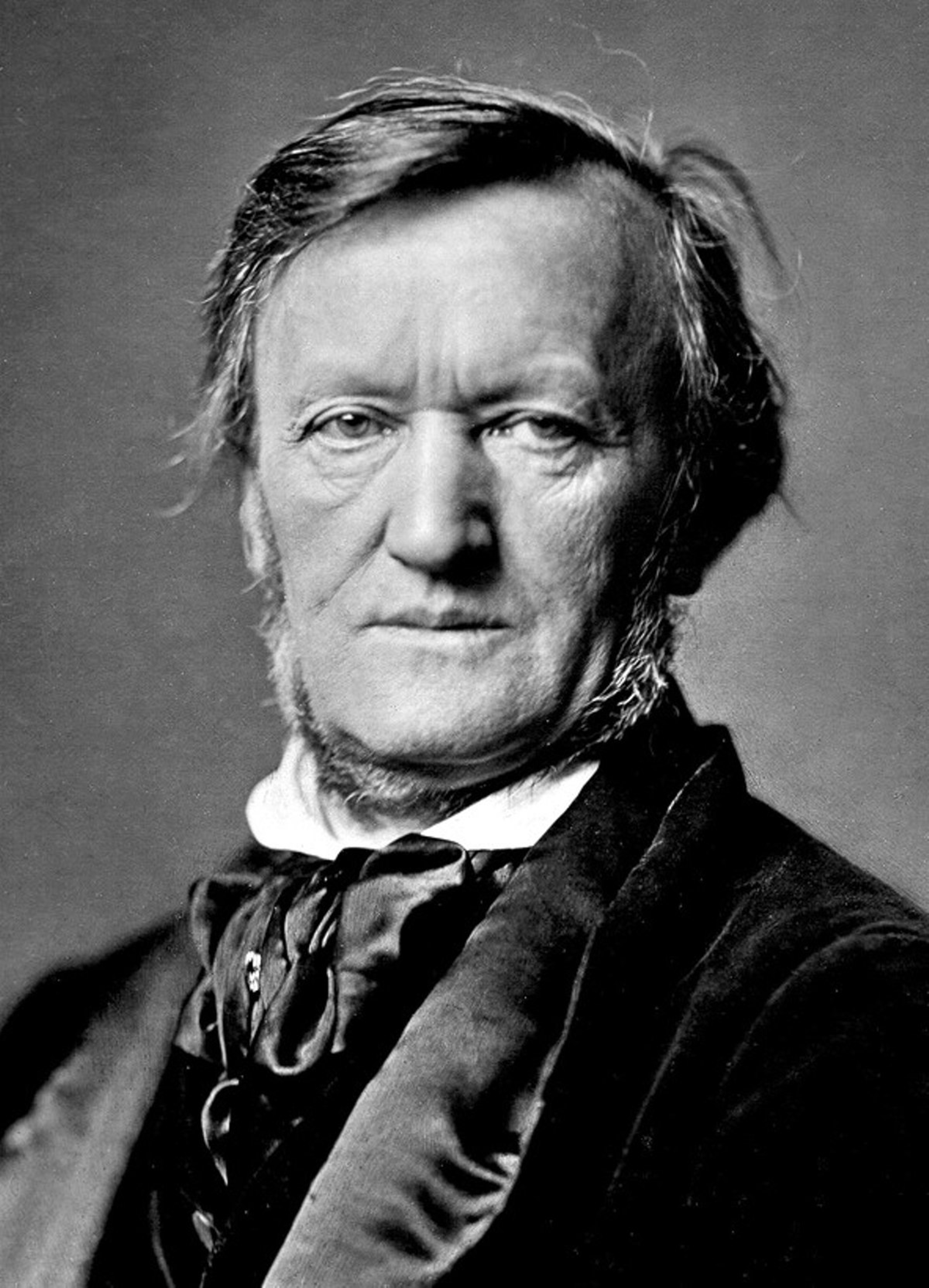 A black-and-white portrait of Richard Wagner, wearing a cravat and glaring at the camera with a serious expression.