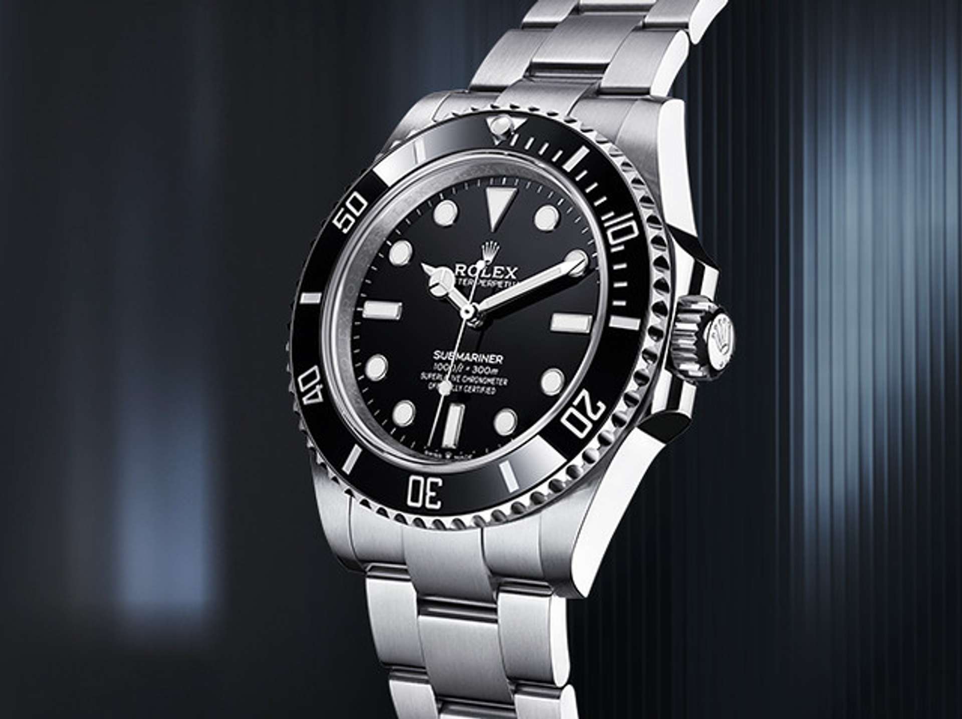 A black and white Rolex Submariner against a dark background, first launched in 1954.