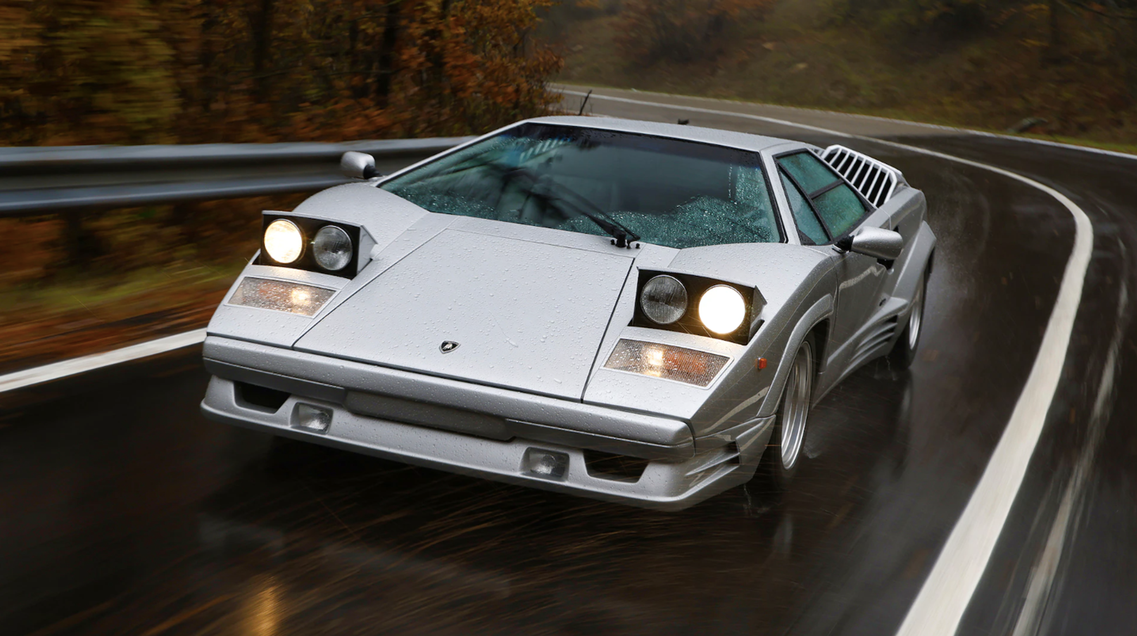 A 1970 Lamborghini Countach on the asphalt.