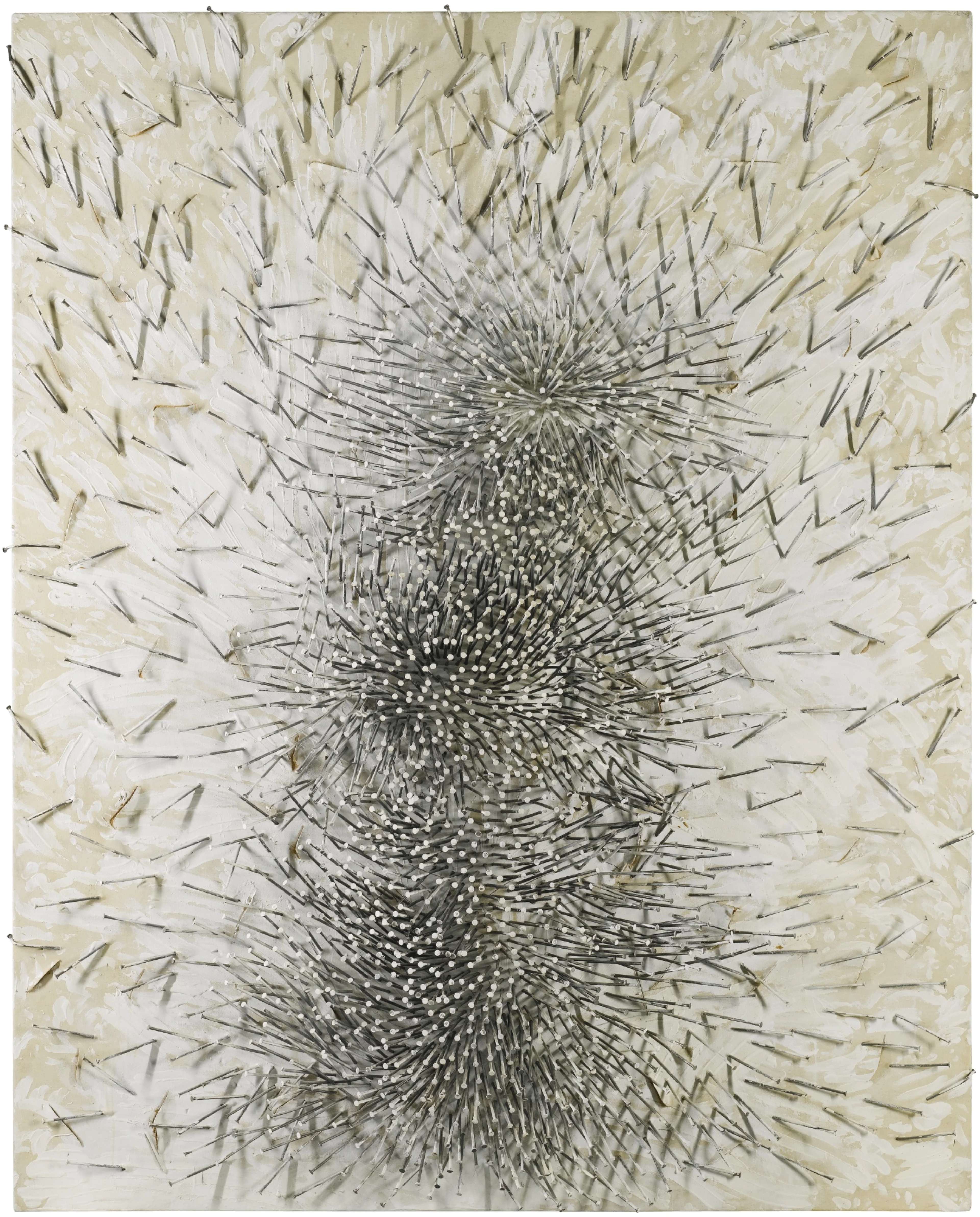 Seemingly randomly placed nails form an intense, expressive arrangement suggesting powerful emotional energy originating in the lower central half of the piece. The pattern appears to surge outwards from this original mass, becoming more sparse towards the upper edge and sides. Each nail seems to be multiplied, due to the effect of its long shadow.