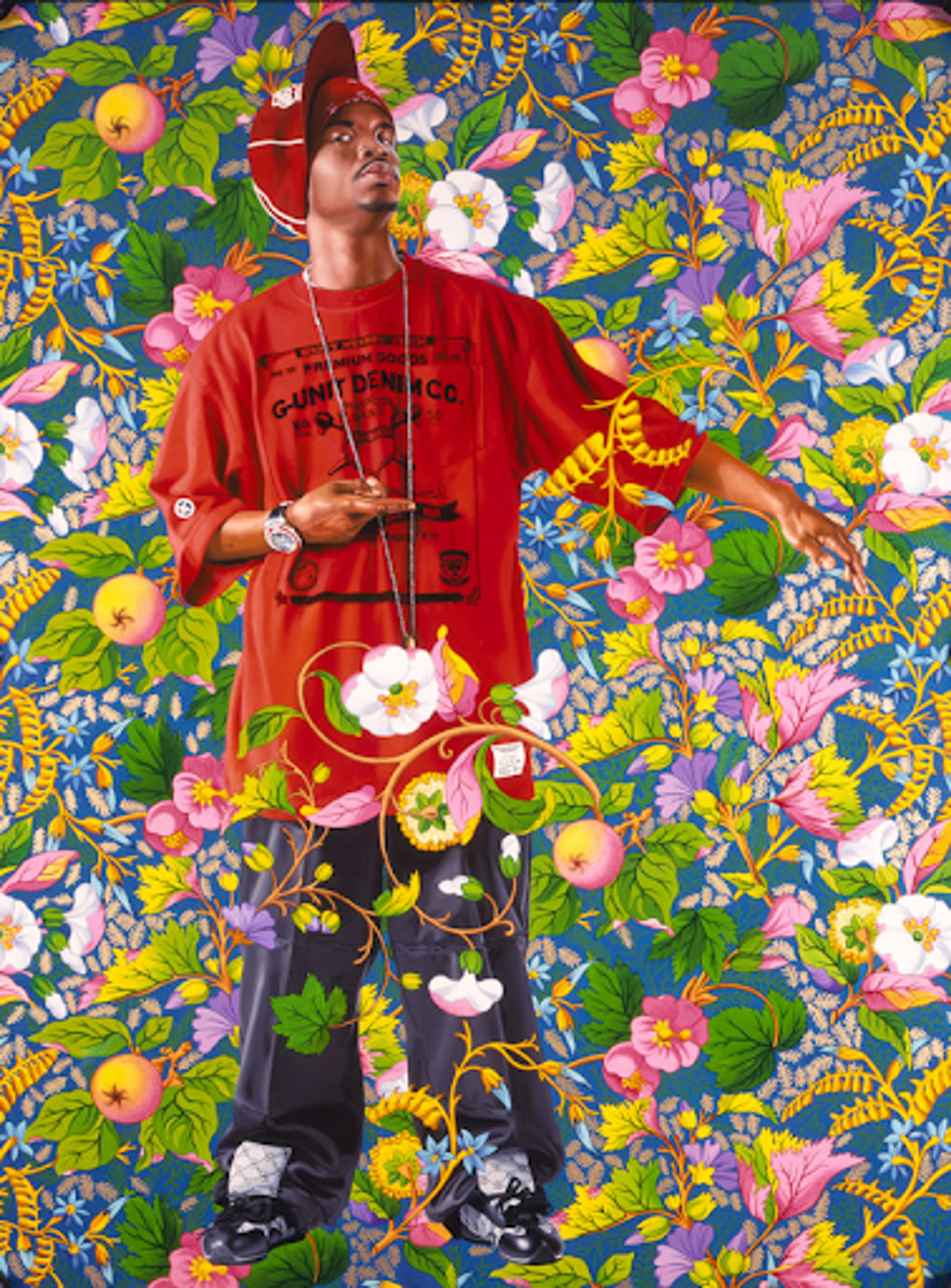 Kehinde Wiley’s Portrait Of A Venetian Ambassador, Aged 59, II. A portrait of a man in a red shirt, red cap, and blue jeans, posed with his left arm pointing outward surrounded by a bright floral background. 