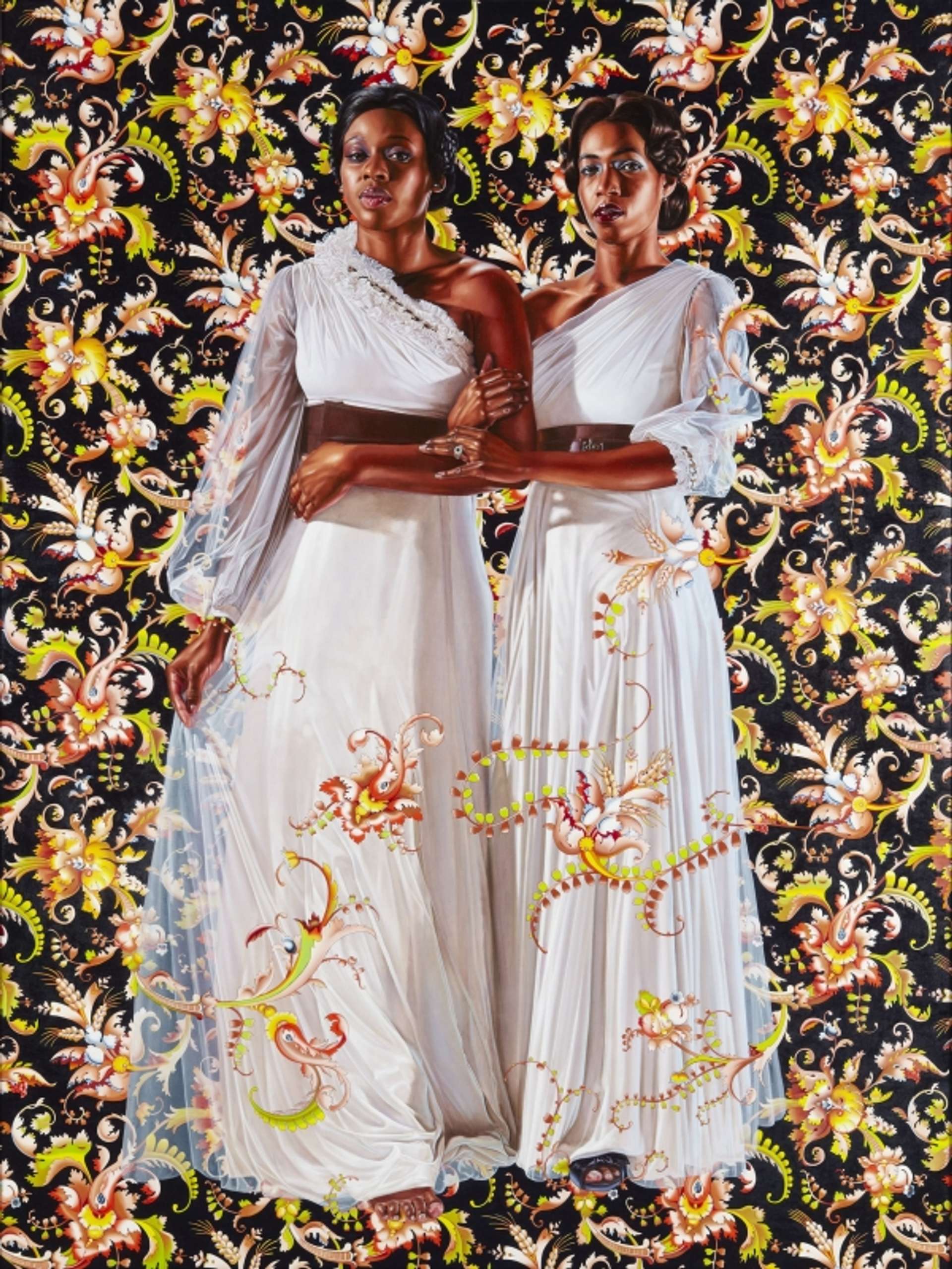 Kehinde Wiley’s The Two Sisters. Two black women standing next to each other, interlocking arms. They are dressed in long white gowns against a black background with floral arrangements.