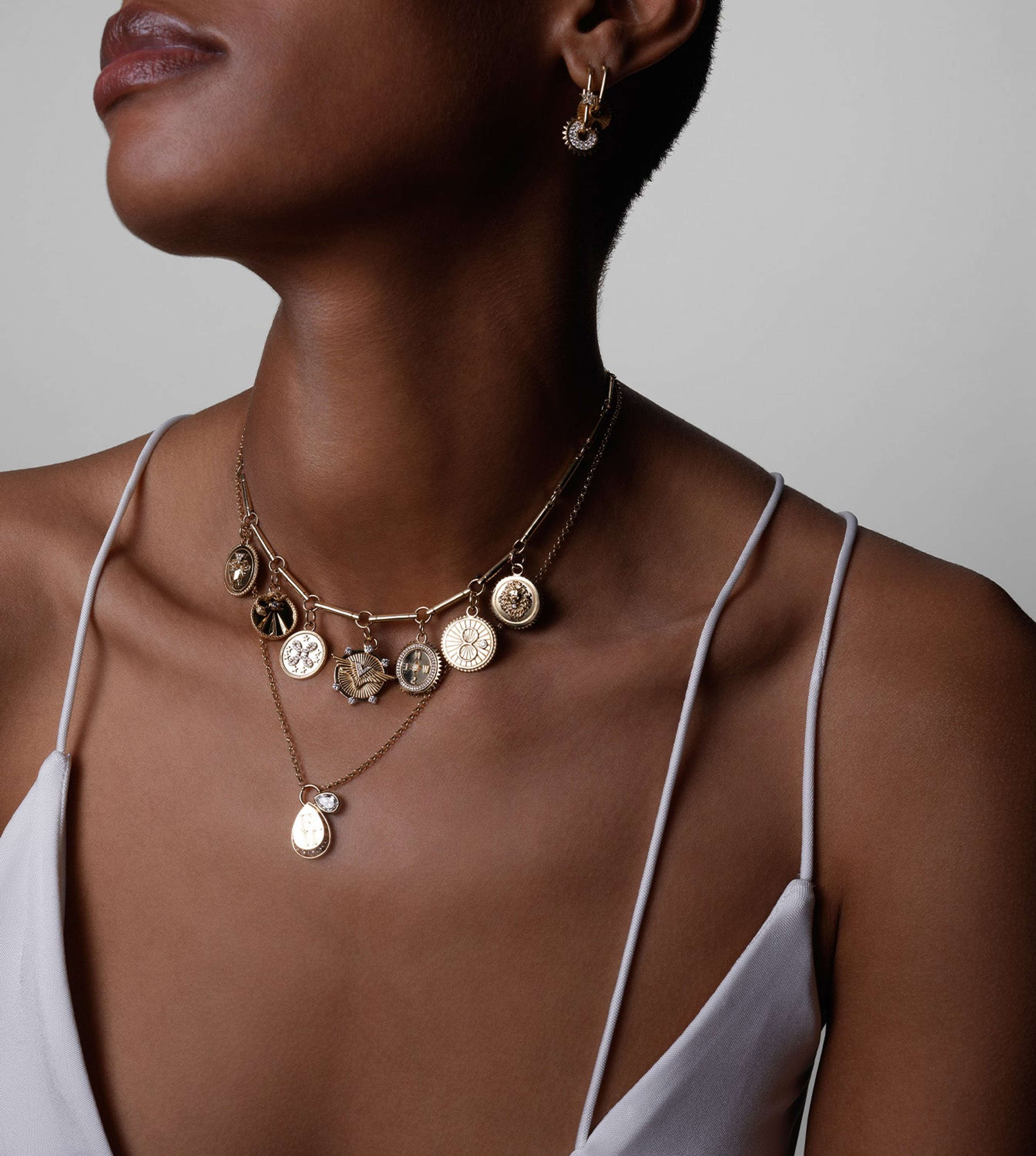 A necklace by FoundRae, featuring their signature protection motifs.