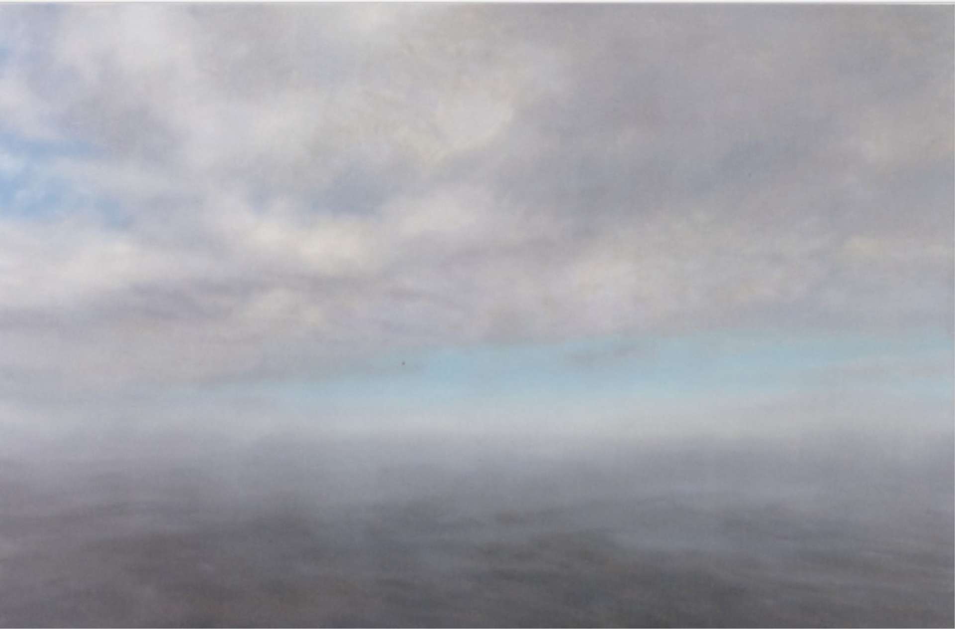Painting by Gerhard Richter depicting a cloudy, blurred seascape. A pale blue sky pokes through behind the grey clouds.