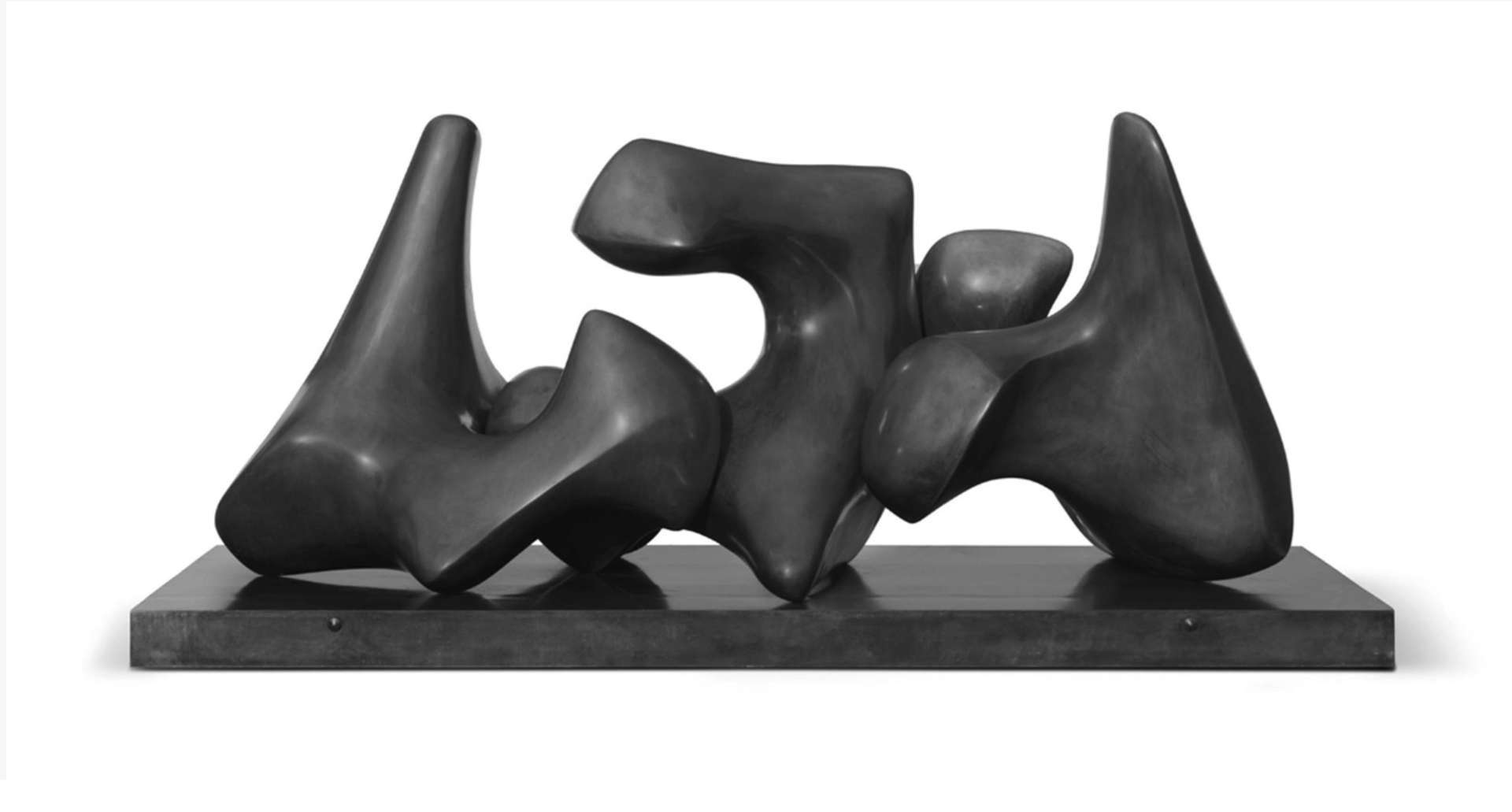 Henry Moore's vertebrae sculpture featuring three interconnected fragments balanced in harmony. Each piece rests upon and supports the others. The sculpture showcases subtle variations in form, enhancing the dynamic viewing experience.