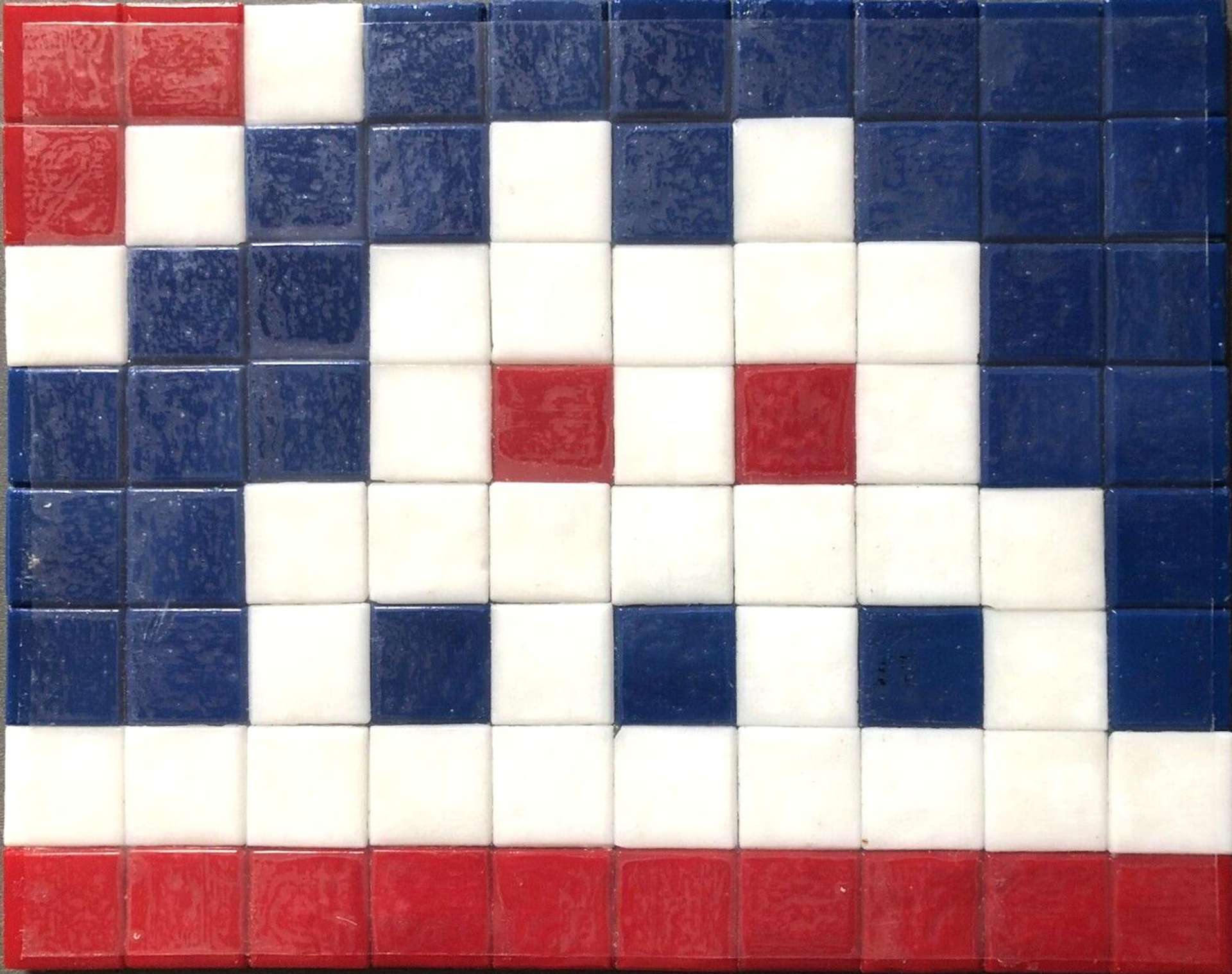 The artwork consists of a set of square, ceramic tiles, predominantly blue which take on the appearance of an alien from the popular arcade game Space Invaders. 