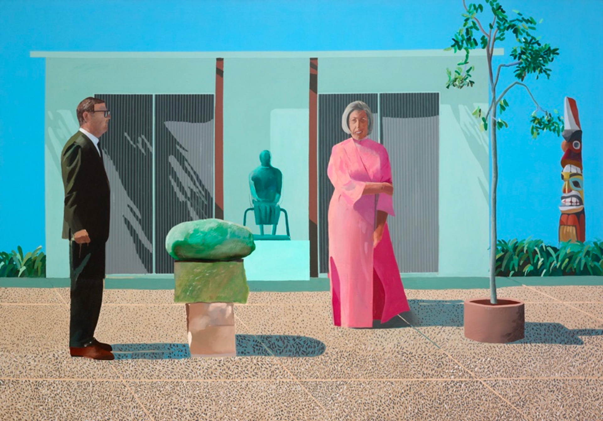 A man in a suit pictured from a side profile looks on at a woman in a pink dress, standing outside an art museum.