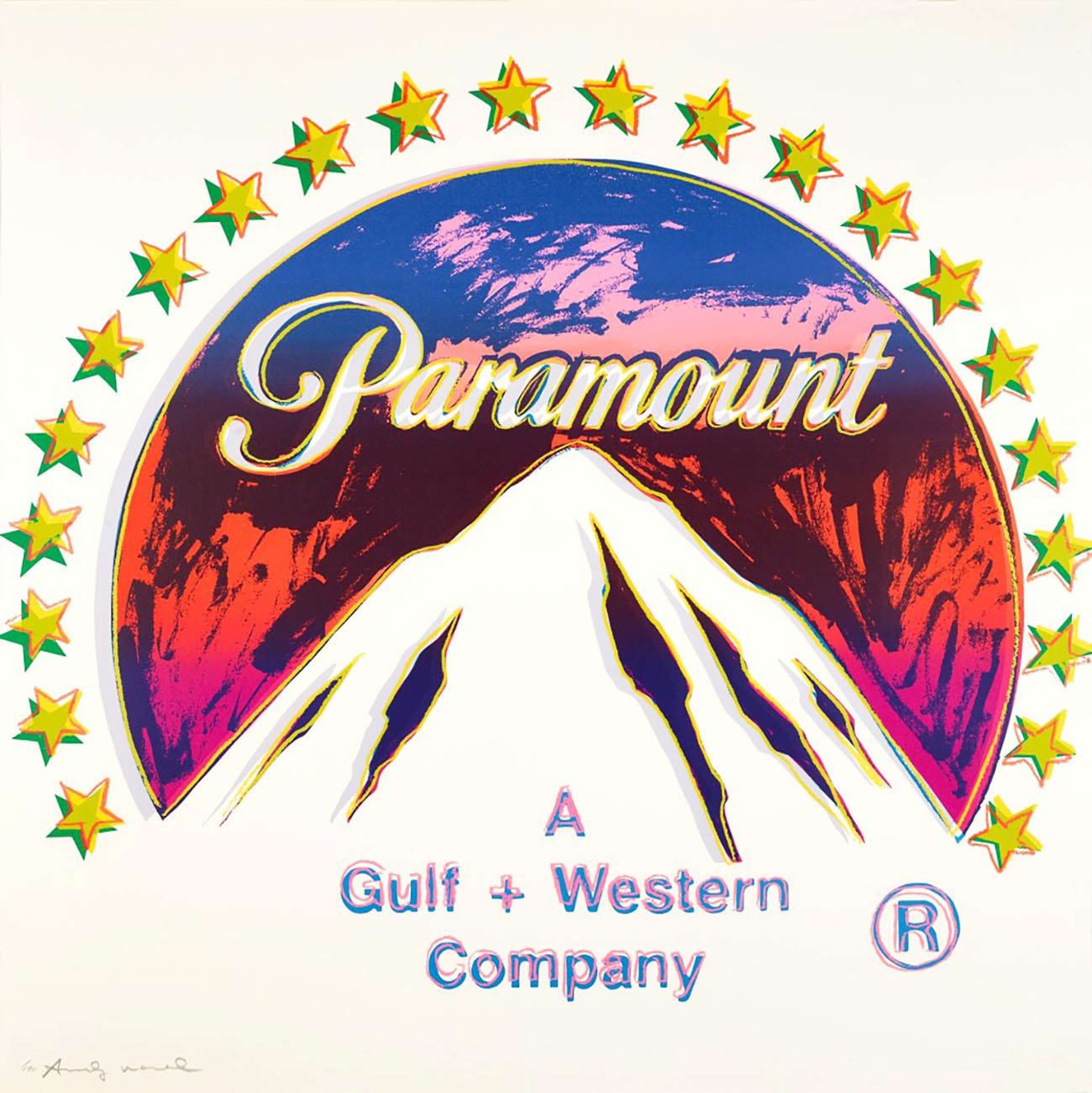Paramount is a colourful screen print by Andy Warhol that captures the well-known logo of the American film studio, Paramount Pictures. Warhol depicts the logo’s iconic mountaintop, rendered in white against a tricoloured backdrop of pink, red and blue. The circular logo in the middle of the print is surrounded by an arch of stars in yellow and green. These vivid and unlikely colours contrast with the print’s white background.