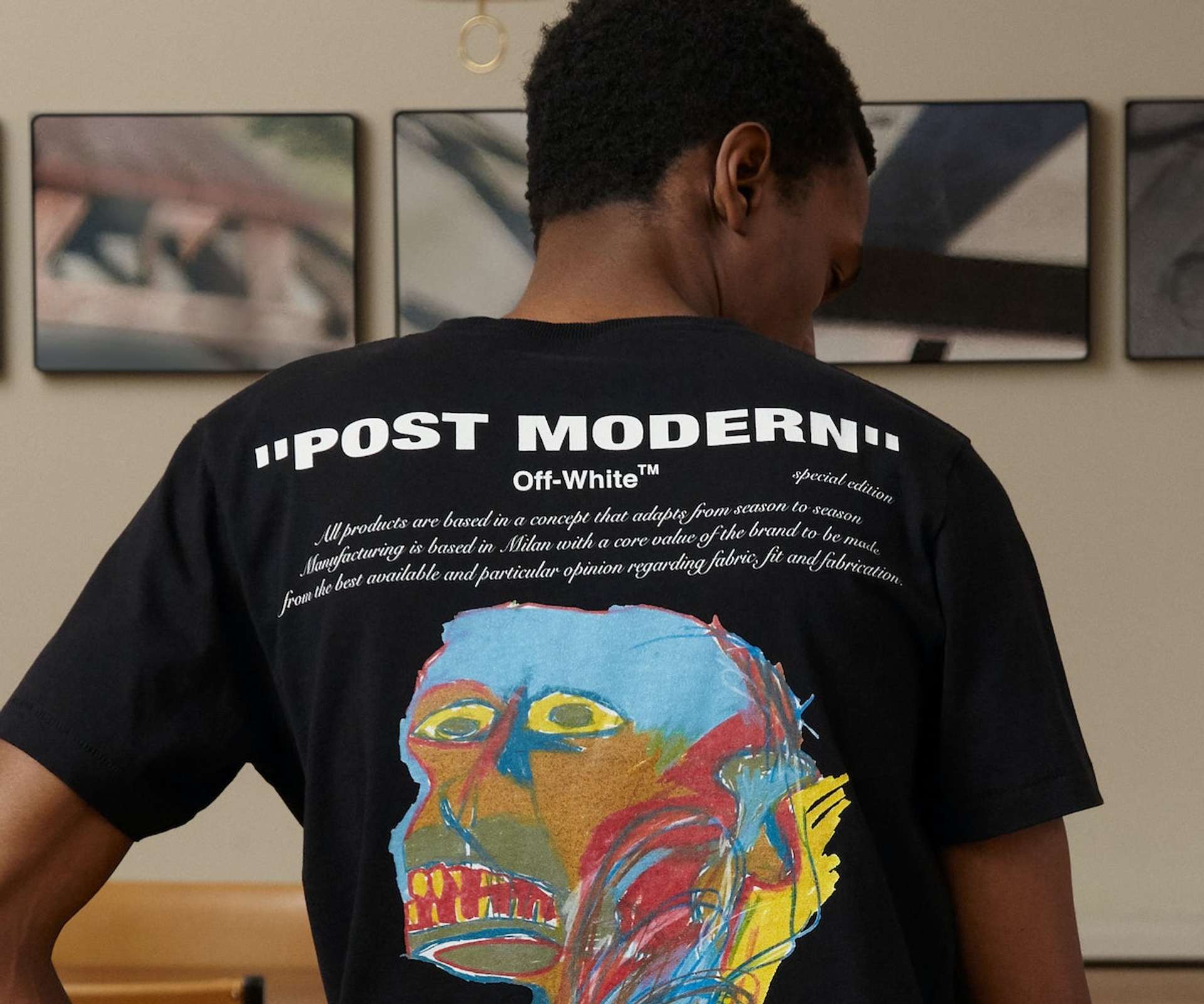 An image of a model wearing a T-shirt from the collaboration between “Off-White” and Basquiat.