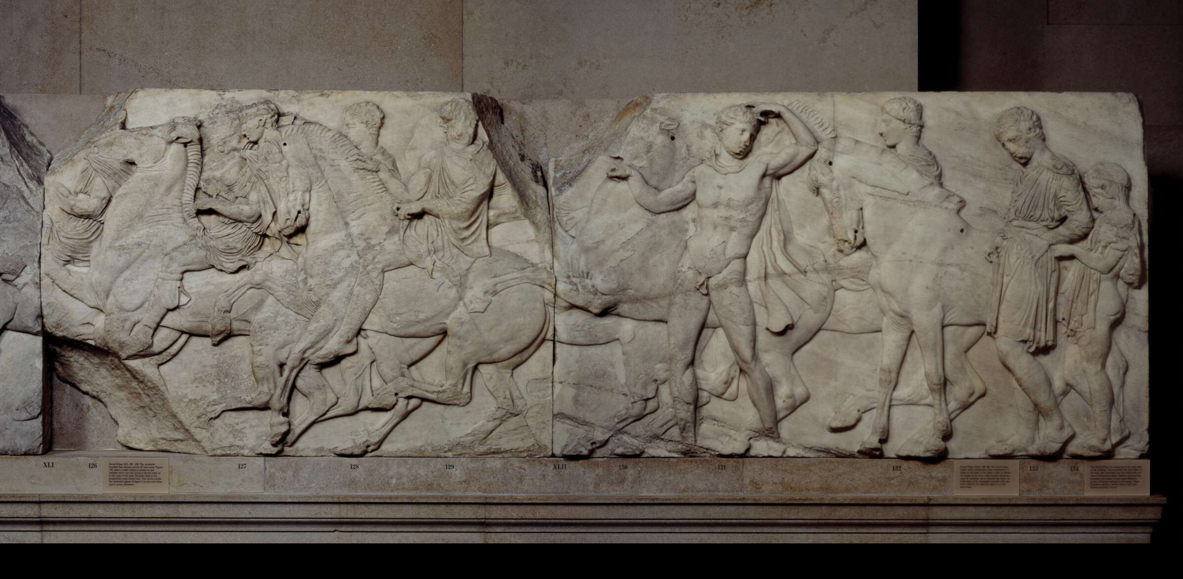 An image of a frieze from the Parthenon marbles. The frieze shows the procession of the Panathenaic festival, the commemoration of the birthday of the goddess Athena.