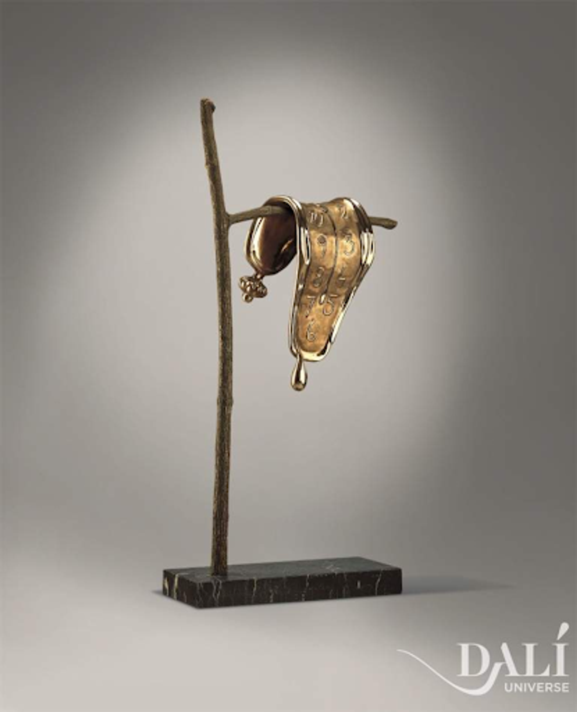 Salvador Dalí’s Persistence of Memory.  A bronze sculpture of a warped clock over a branch