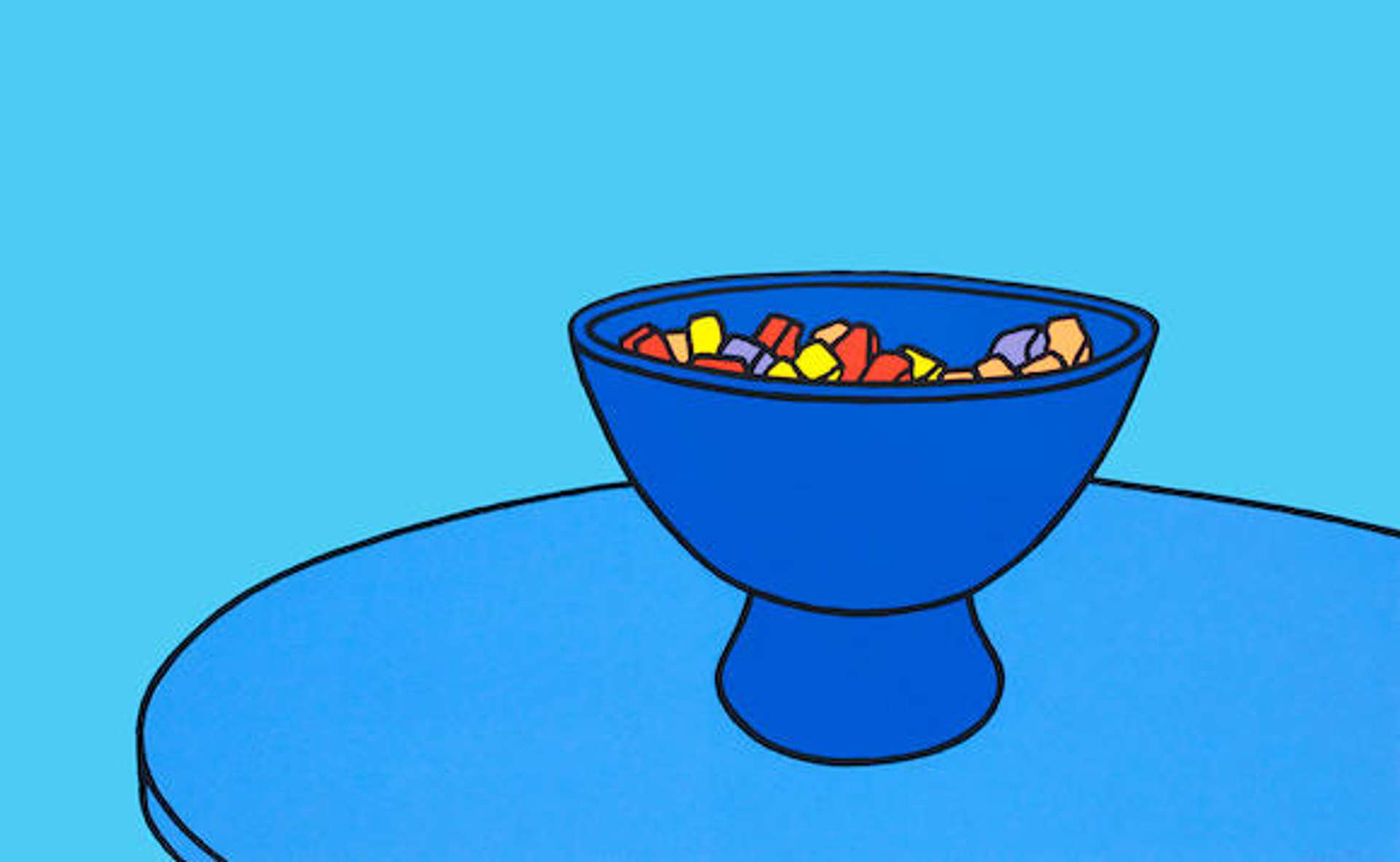  A single blue bowl filled with yellow, red, and purple candies placed on a cropped blue table against a backdrop of different shades of blue.