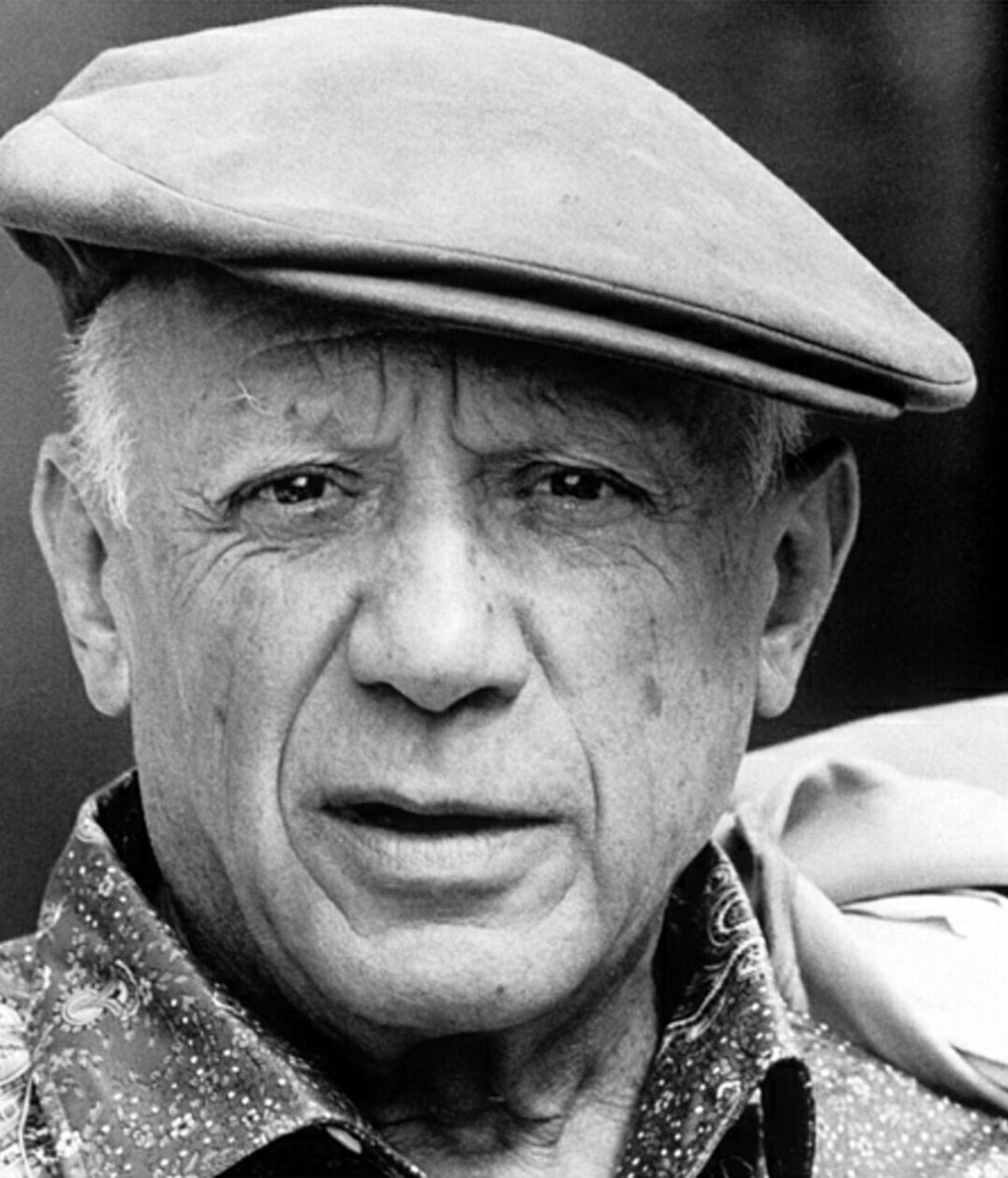 Black and white photographic portrait of Pablo Picasso.
