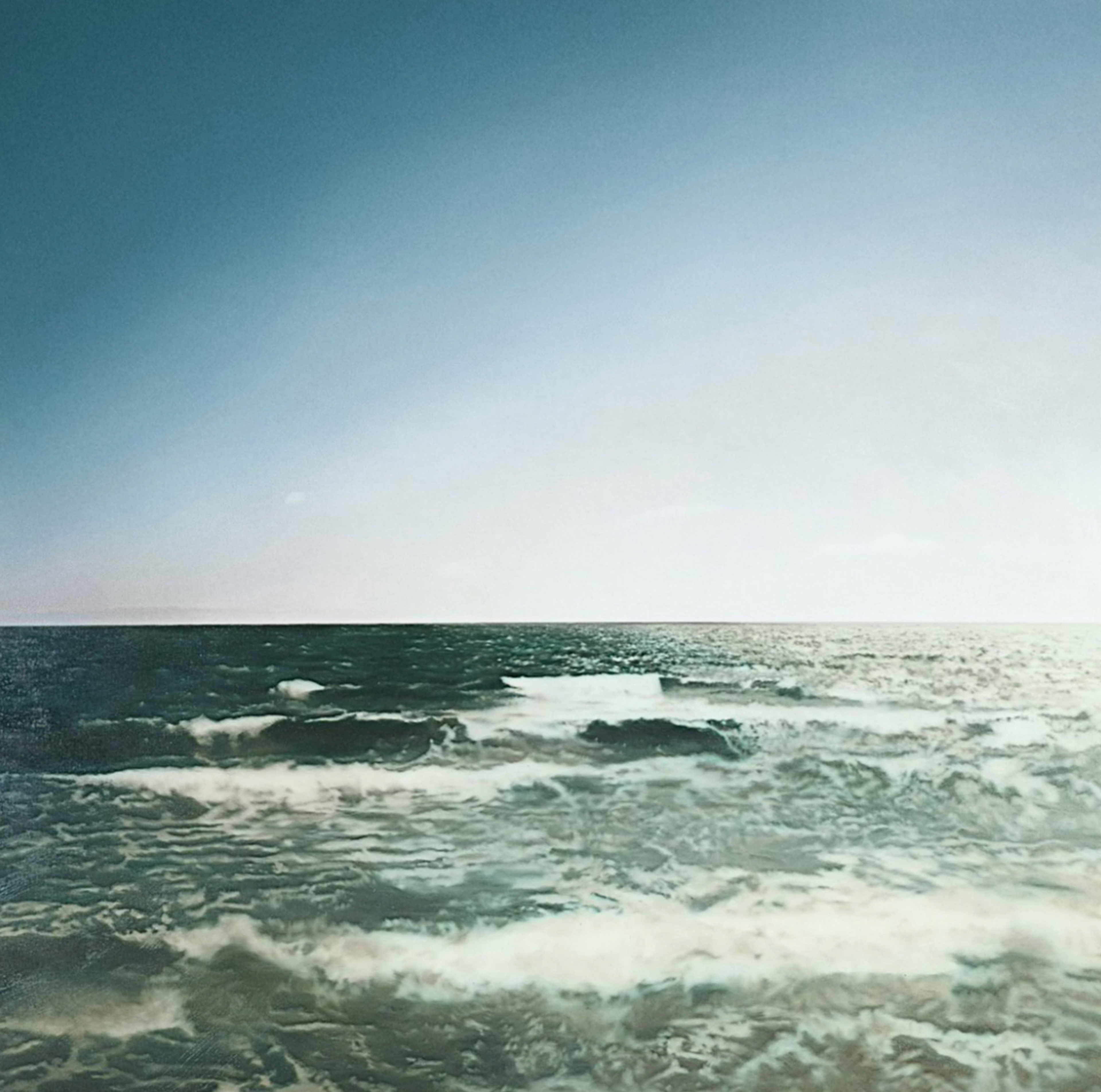 Photorealist painting by Gerhard Richter, depicting the sea in murky green against a bright white and blue sky.