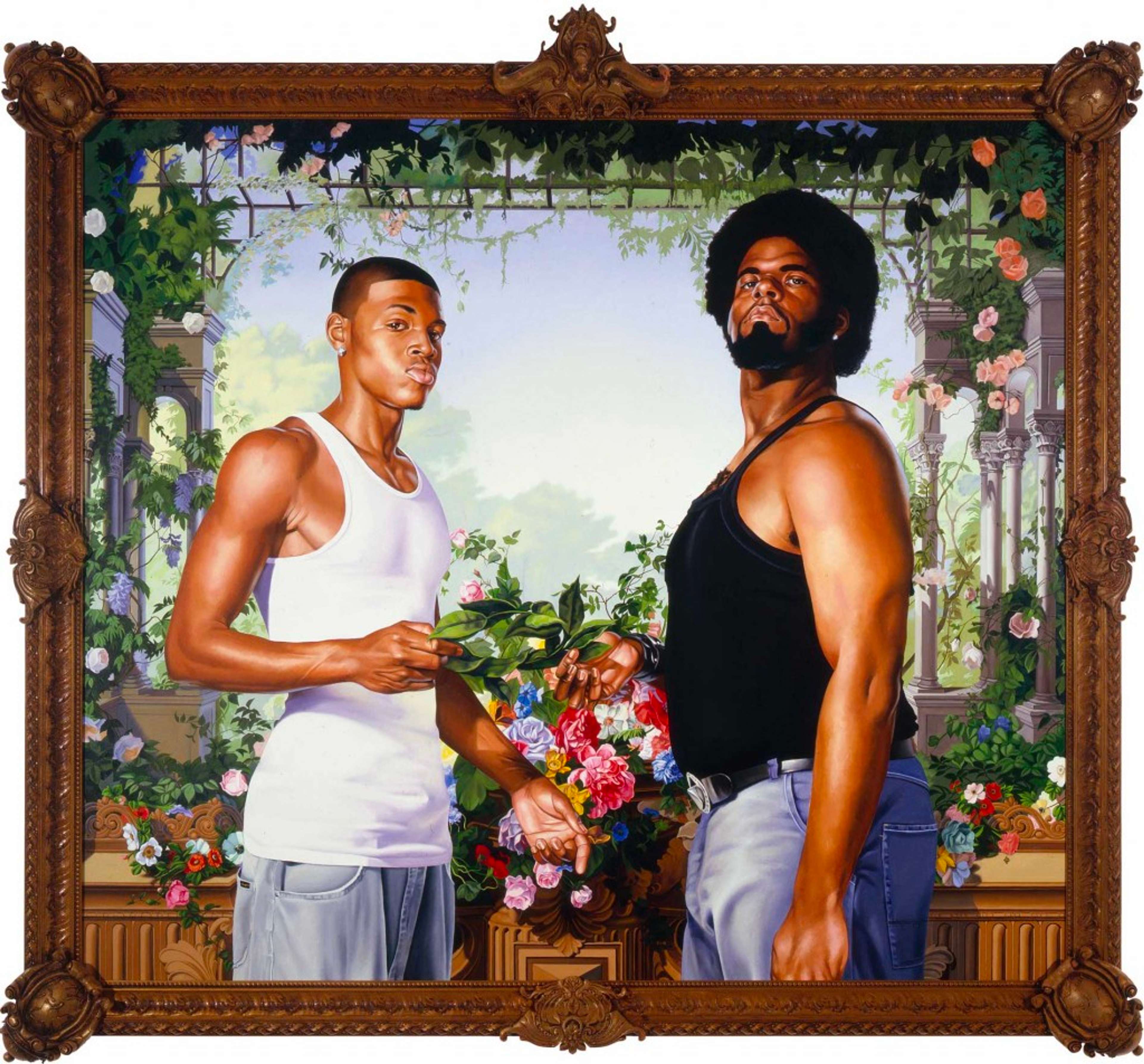 Two young men dressed in vests and jeans stand next to each other, their bodies angled sideways and looking down at the camera. They hold a branch of leaves together; behind them is a decadent bouquet and roses wrapping around stone arches in the distance.