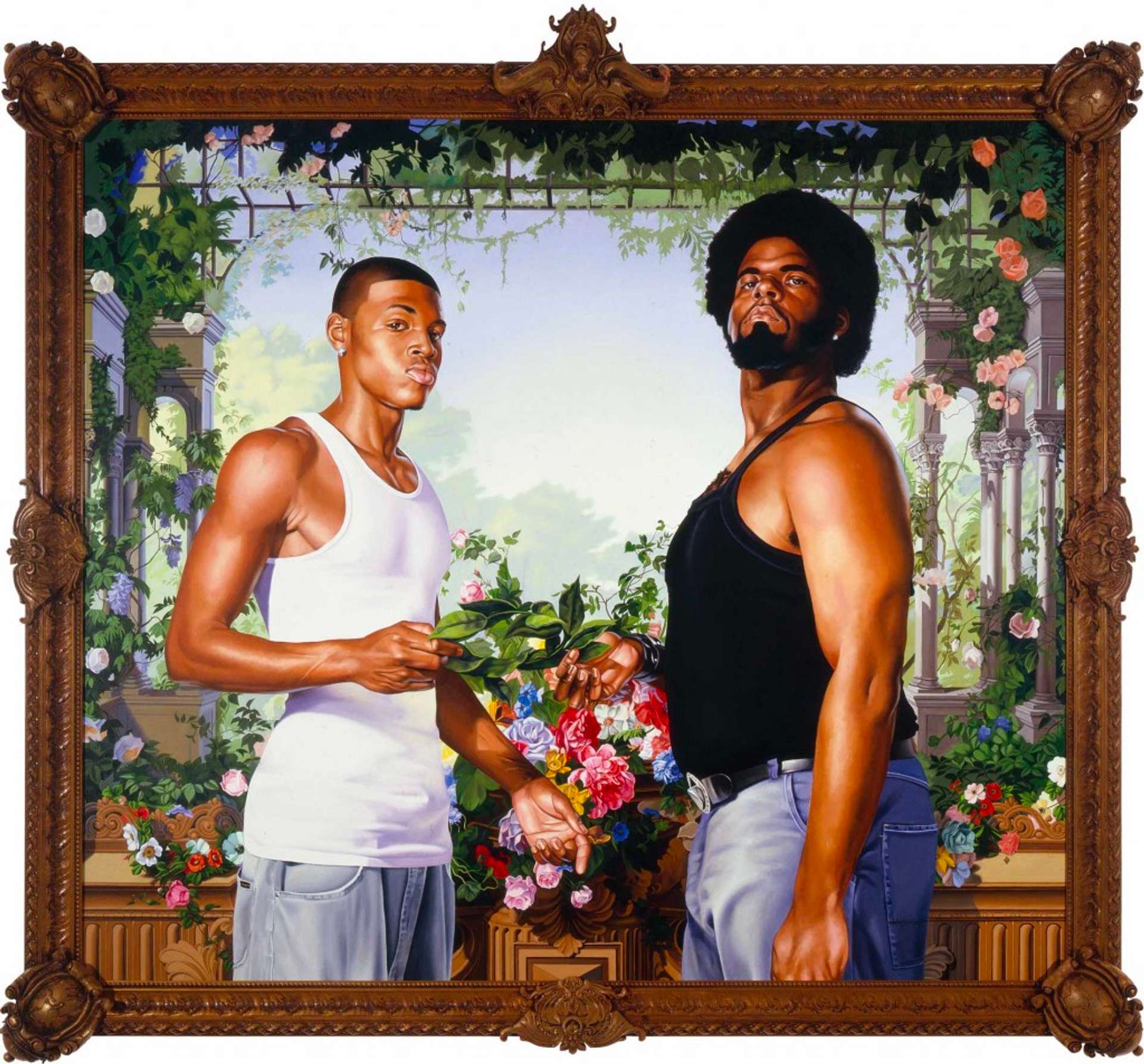 Two young men dressed in vests and jeans stand next to each other, their bodies angled sideways and looking down at the camera. They hold a branch of leaves together; behind them is a decadent bouquet and roses wrapping around stone arches in the distance.