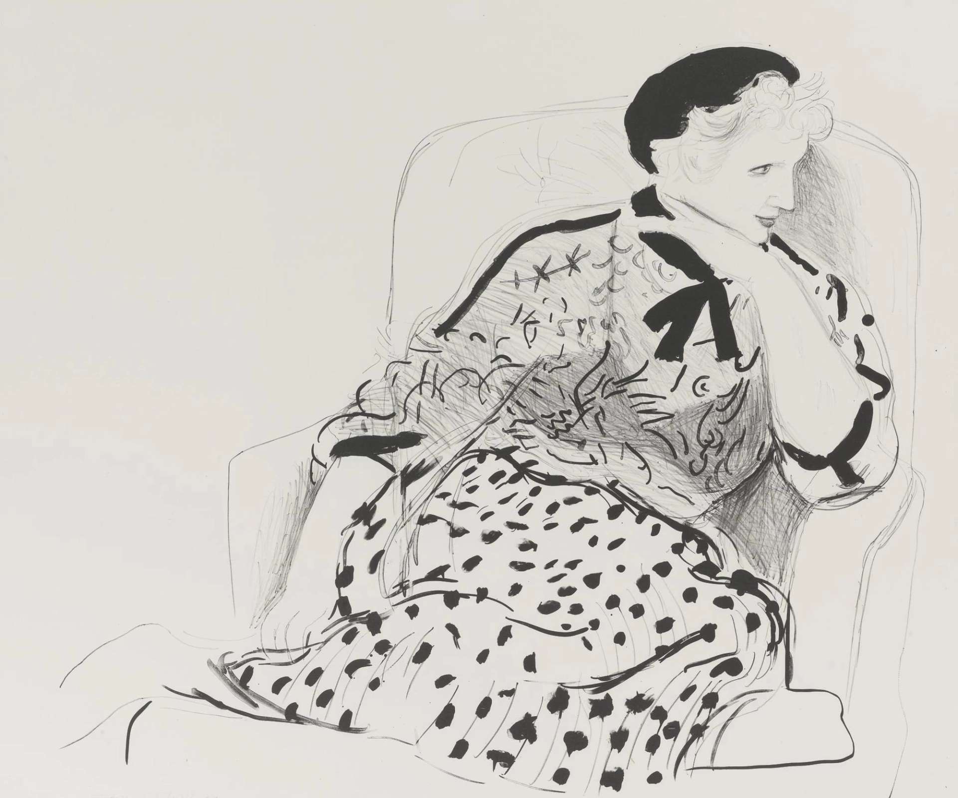  Celia Birtwell is shown curled up in an armchair, her head turned to the side in profile, her hand resting underneath her chin. She appears to be listening intently to someone ‘offscreen’, her elegant features seemingly unaware of the artist’s gaze. She wears a sheer top embroidered with flowers or an abstract pattern, and a full pleated skirt which covers her legs.