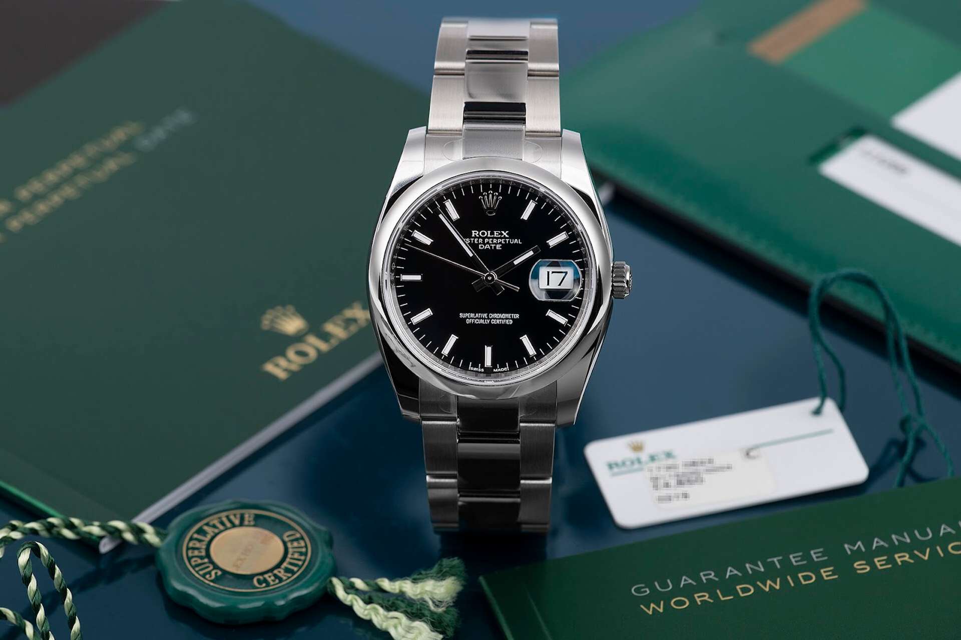 An image of a black dial Rolex Oyster Perpetual.