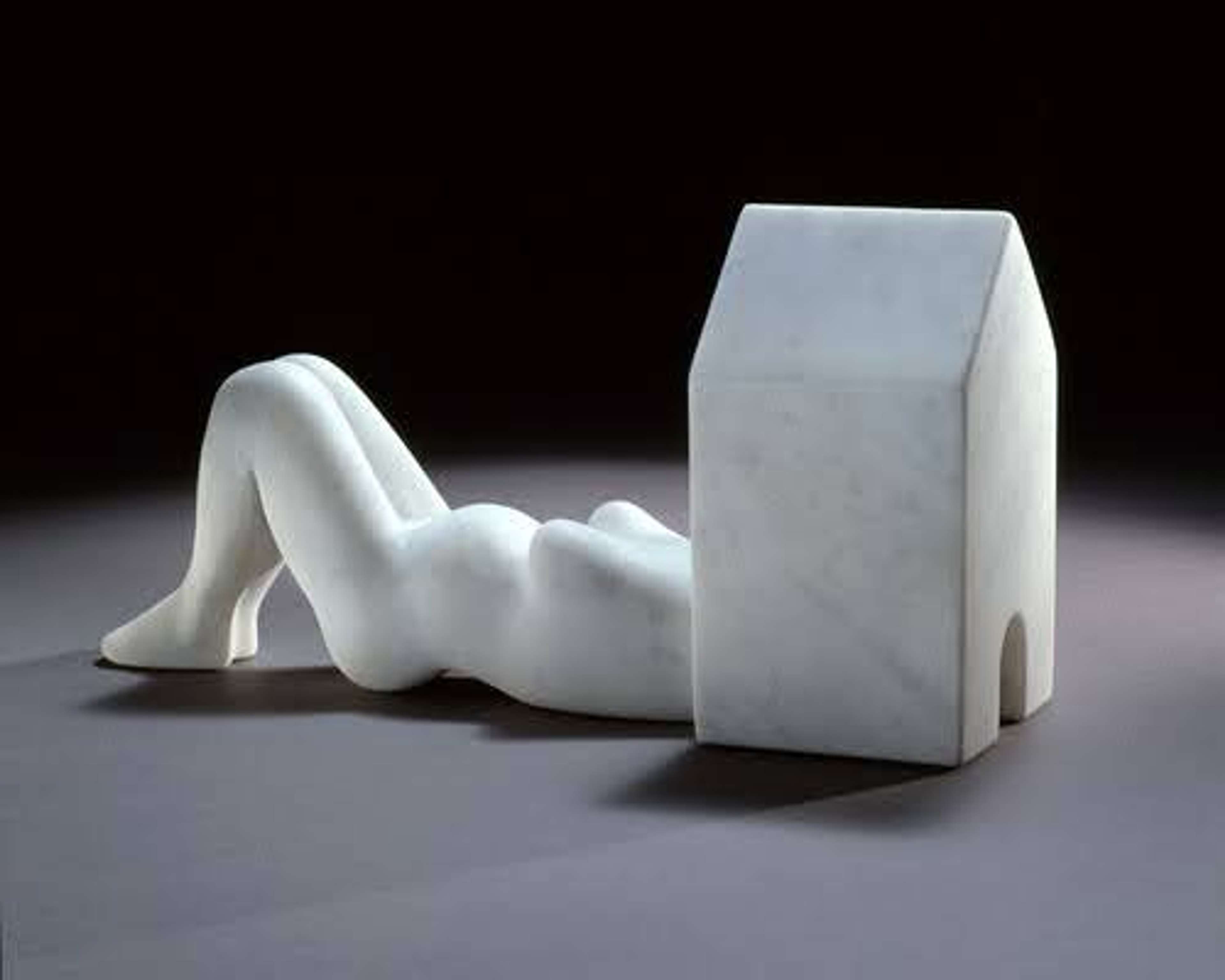 Louise Bourgeois’ Femme Maison.  A white marble sculpture of a pregnant woman lying down with her head inside of a home structure. 