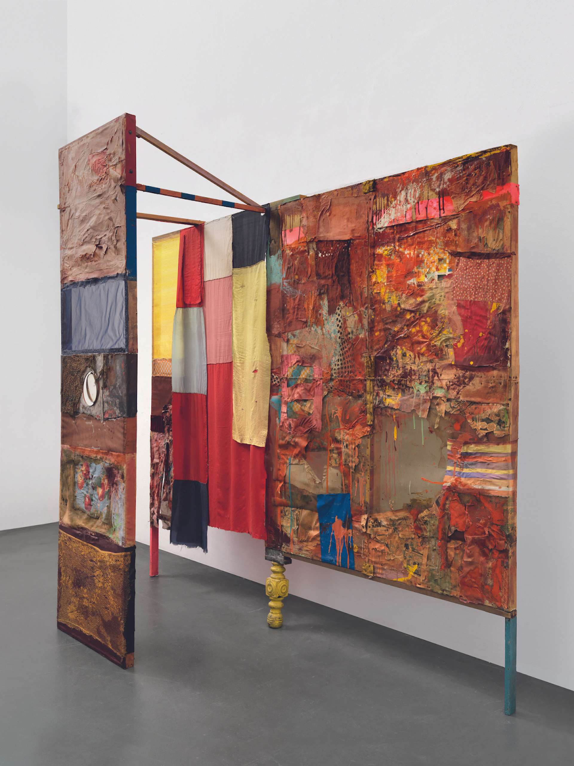 Robert Rauschenberg and Jasper Johns’ Minutiae. An assemblage of multiple placements of fabric that are painted on, incorporated with metal, wood, and newspaper.