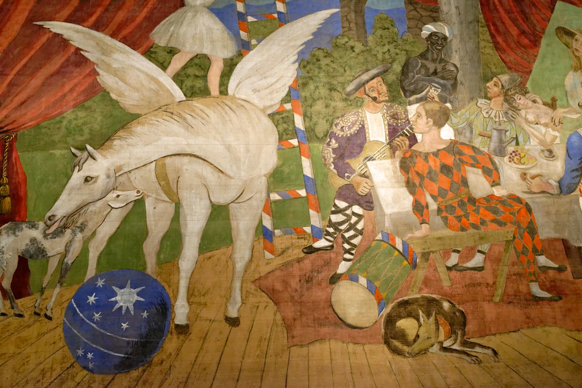 This curtain, painted by Pablo Picasso, shows a group of performers on a stage while, to the left, a winged mare stands to the left with a suckling foal and a fairy perched on its back.