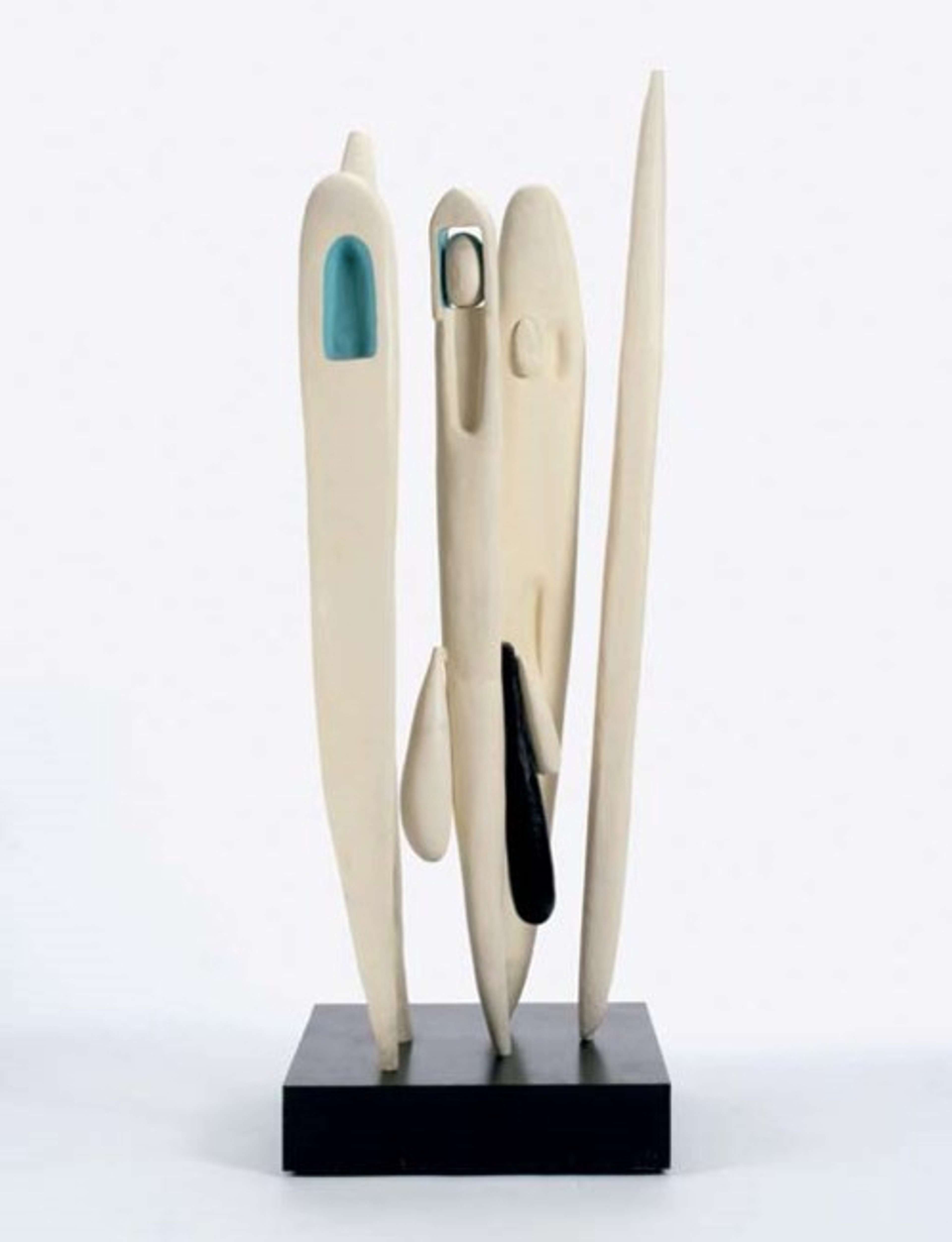 A bronze polychrome sculpture with five slender totem-like structures rising from a base, delicately balanced on their tips. The sculpture exhibits blue concave crevices and elongated, phallic-like extensions protruding from the bottom of some of the totems.