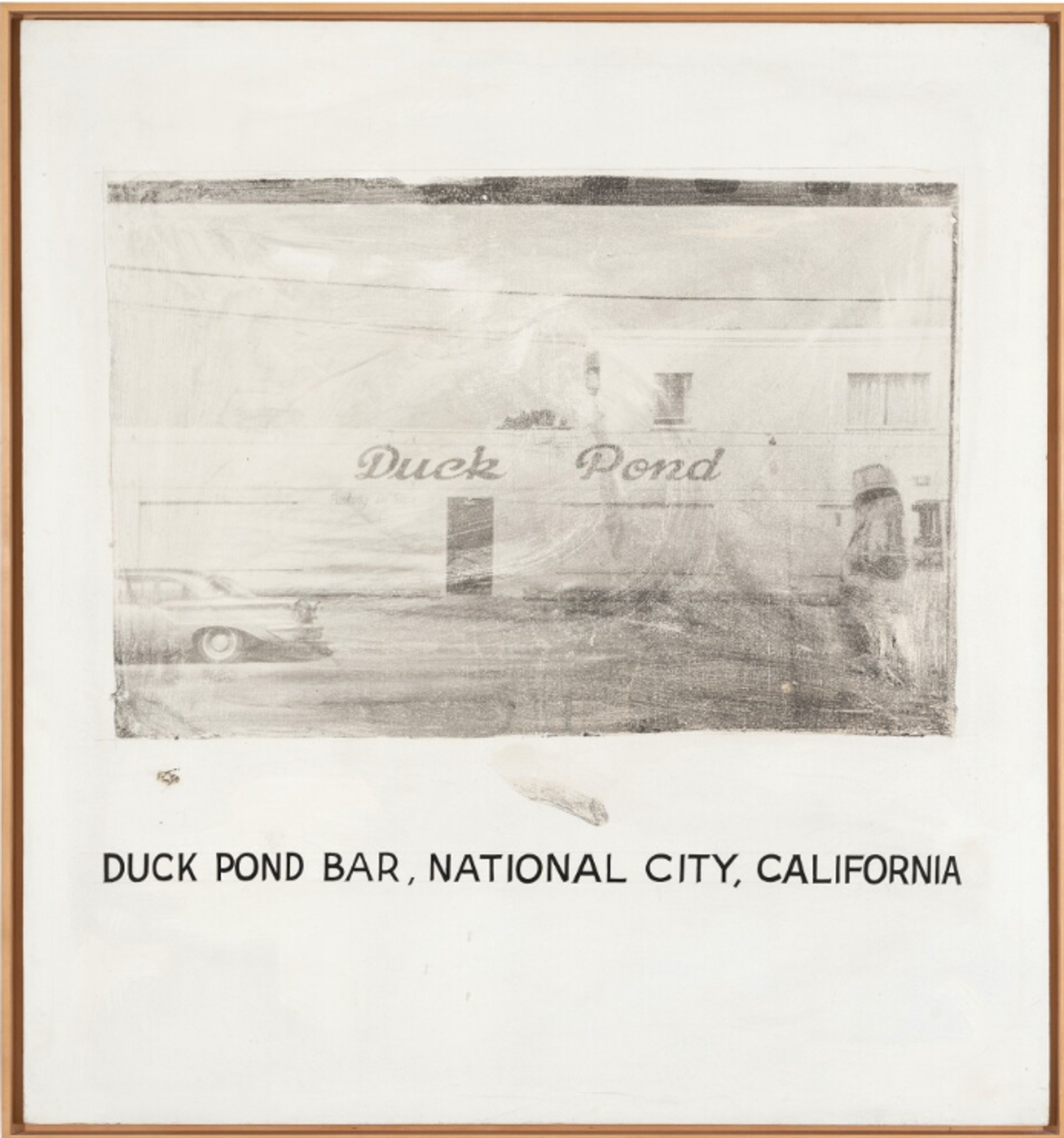 A black-and-white photograph with a rough textured finish that partially obscures the subject. The photograph depicts the front of a bar with “Duck Pond” written above the door. Telephone lines pass overhead, and a car is parked outside the front. Underneath the photograph on the large white margin, the words “Duck Pond Bar, National City, California” are written in block capitals.