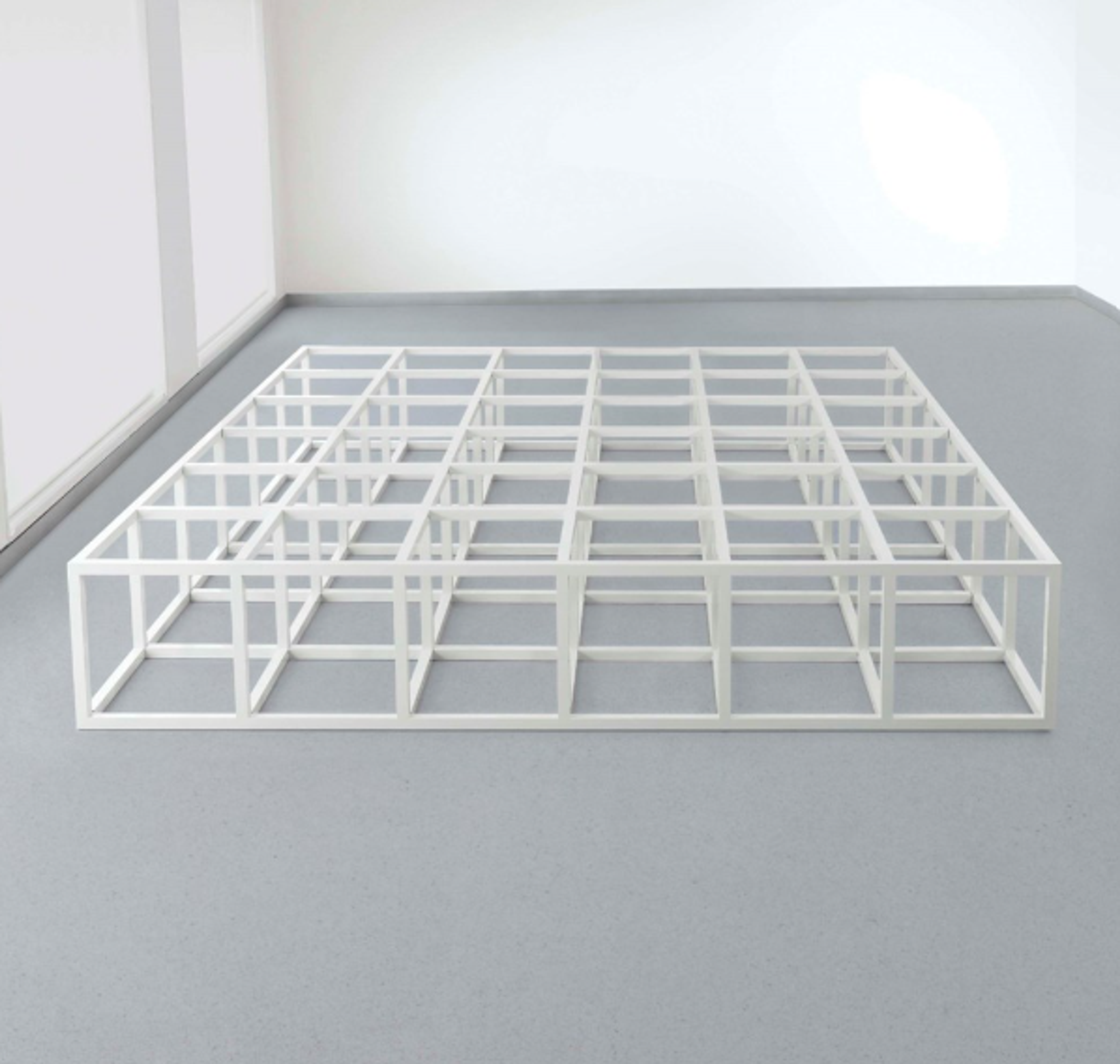 A single layer of modular open white cubes, arranged in a horizontal geometric square.
