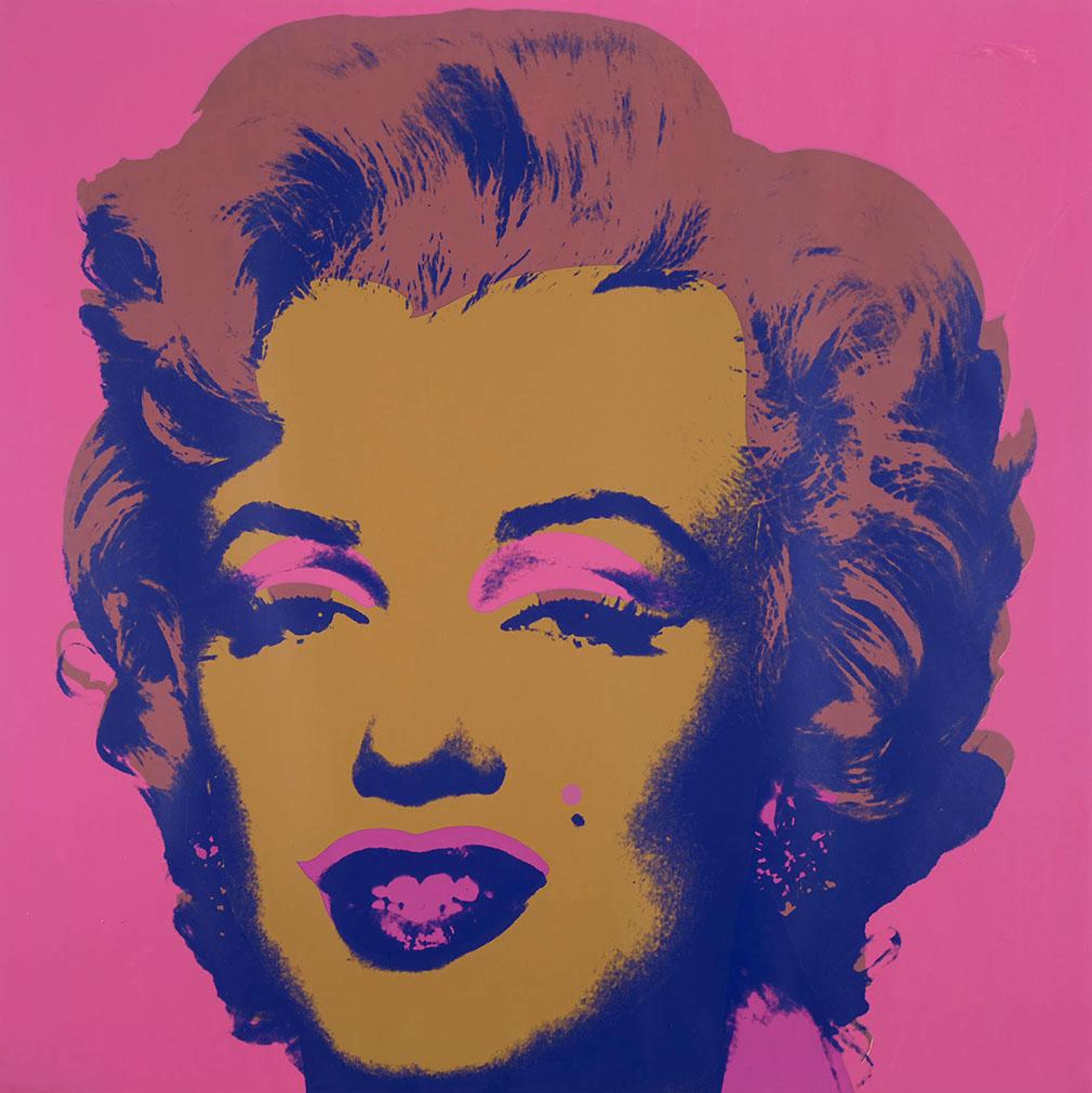 A screen print by Andy Warhol, titled “Marilyn (F. & S. II.27) – Signed Print”, depicting a bold Pop Art portrait of Marilyn Monroe’s face with stylised features in vibrant orange, brown and bright pink tones against a pink background, part of his iconic 1967 Marilyn series.