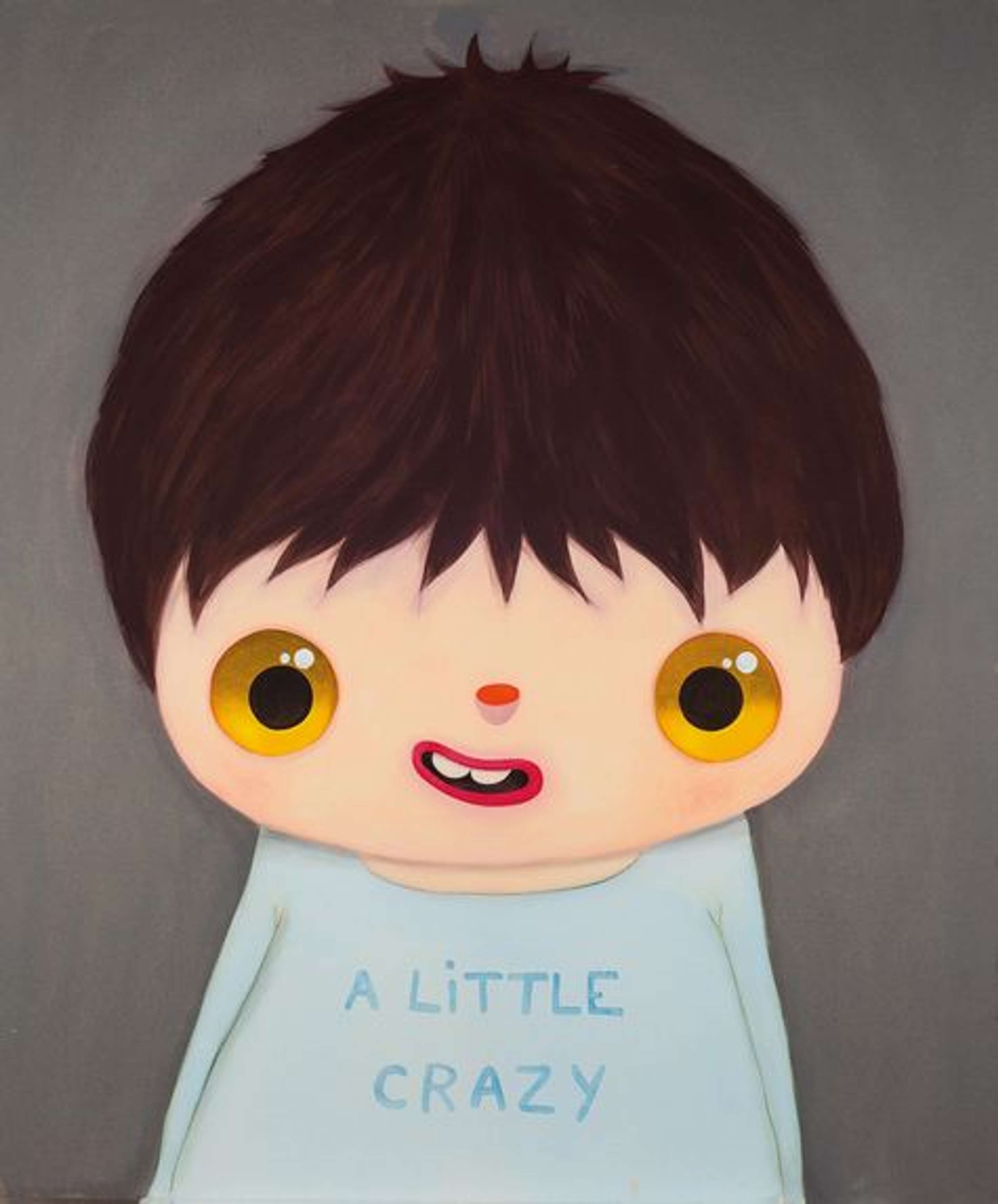 A stylised child with short brown hair, perfectly round orange-gold eyes, and a smiling red mouth with two exposed white teeth, stands against a muted grey background, wearing a light blue shirt with the words "A LITTLE CRAZY" visible in a darker blue.