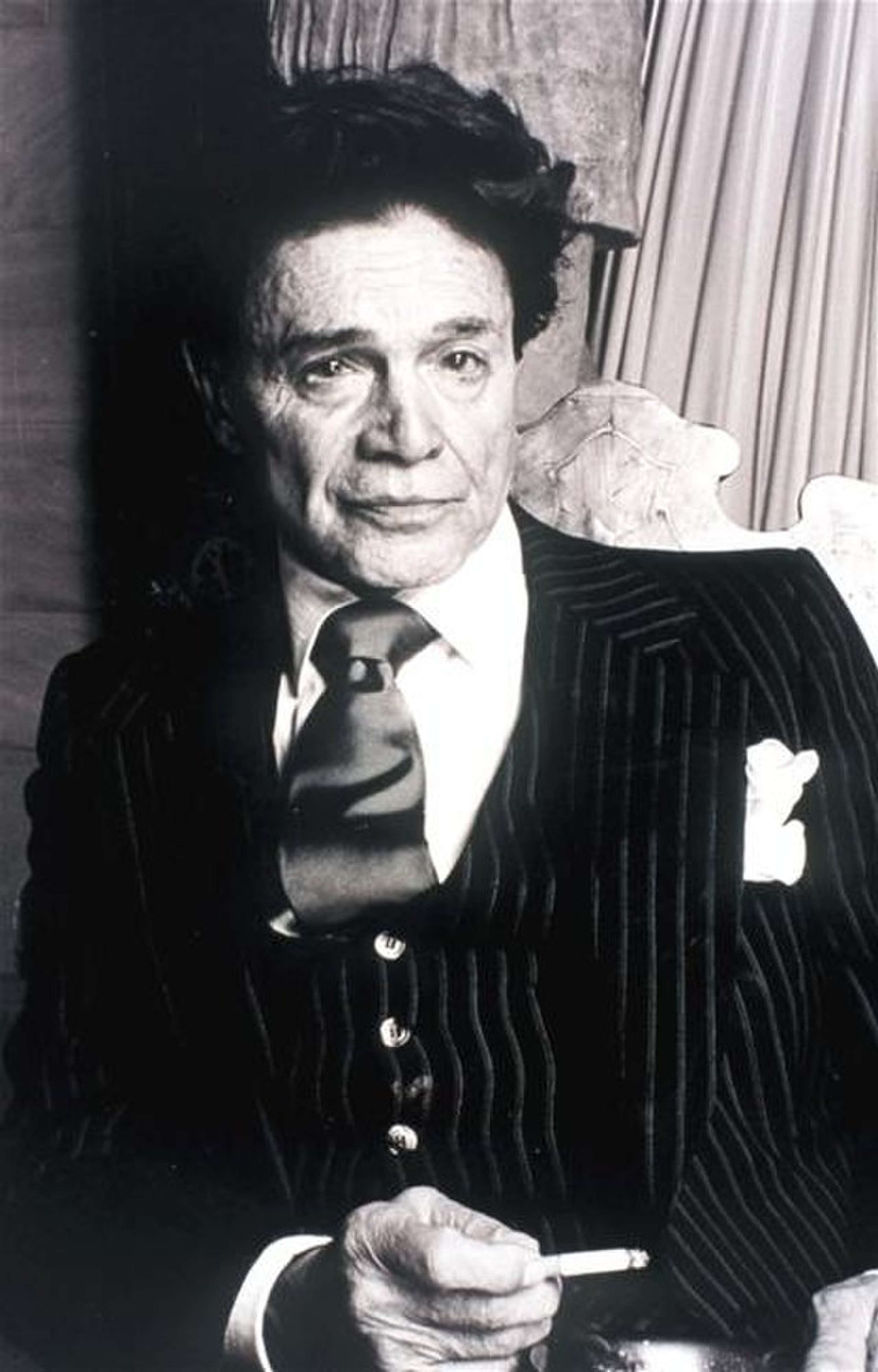 A black and white portrait of Alexander Iolas
