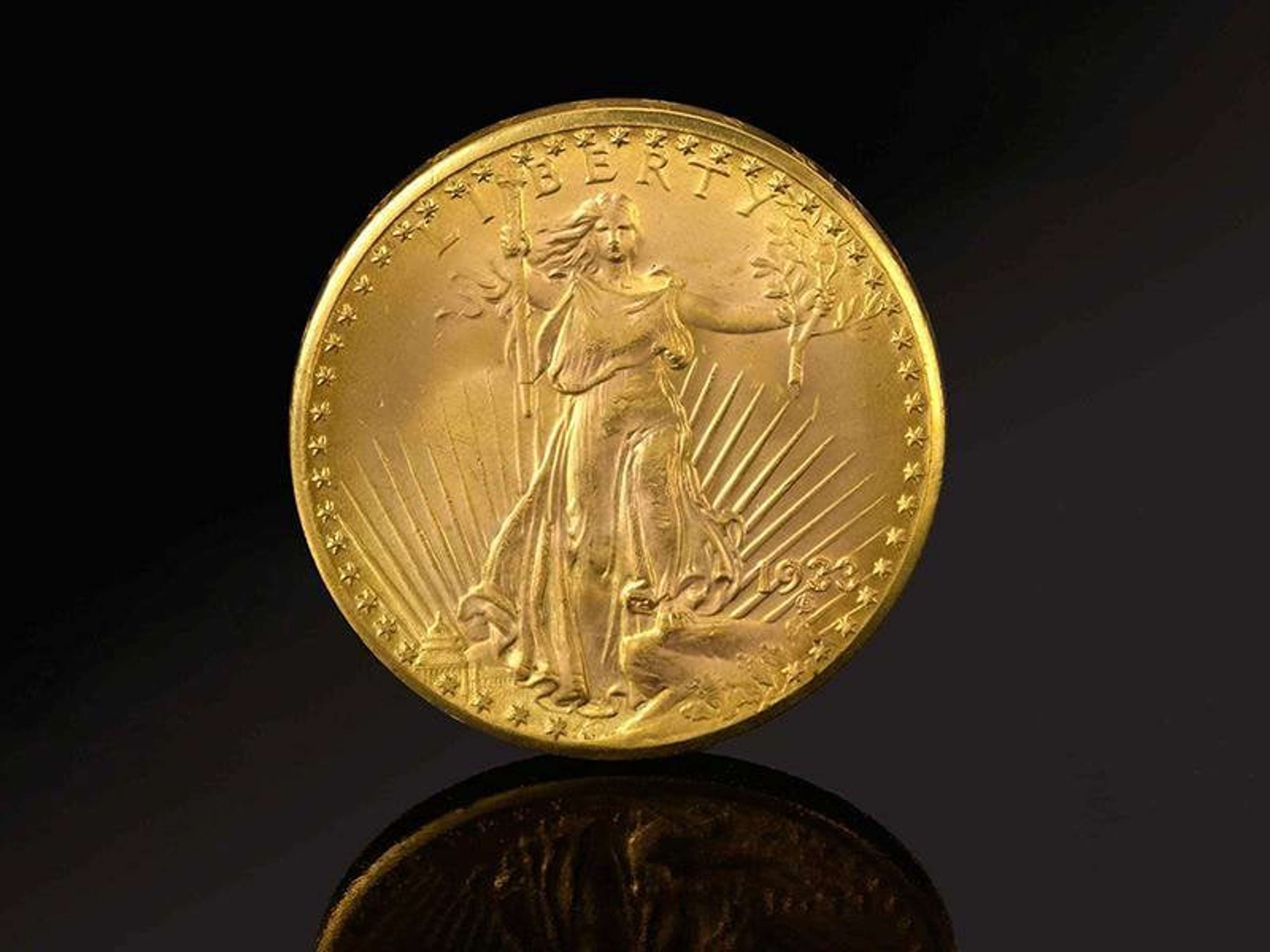 Pièce de monnaie en or avec une figure féminine en relief représentant la « Liberté », sortant de l'eau et tenant une branche et un bâton