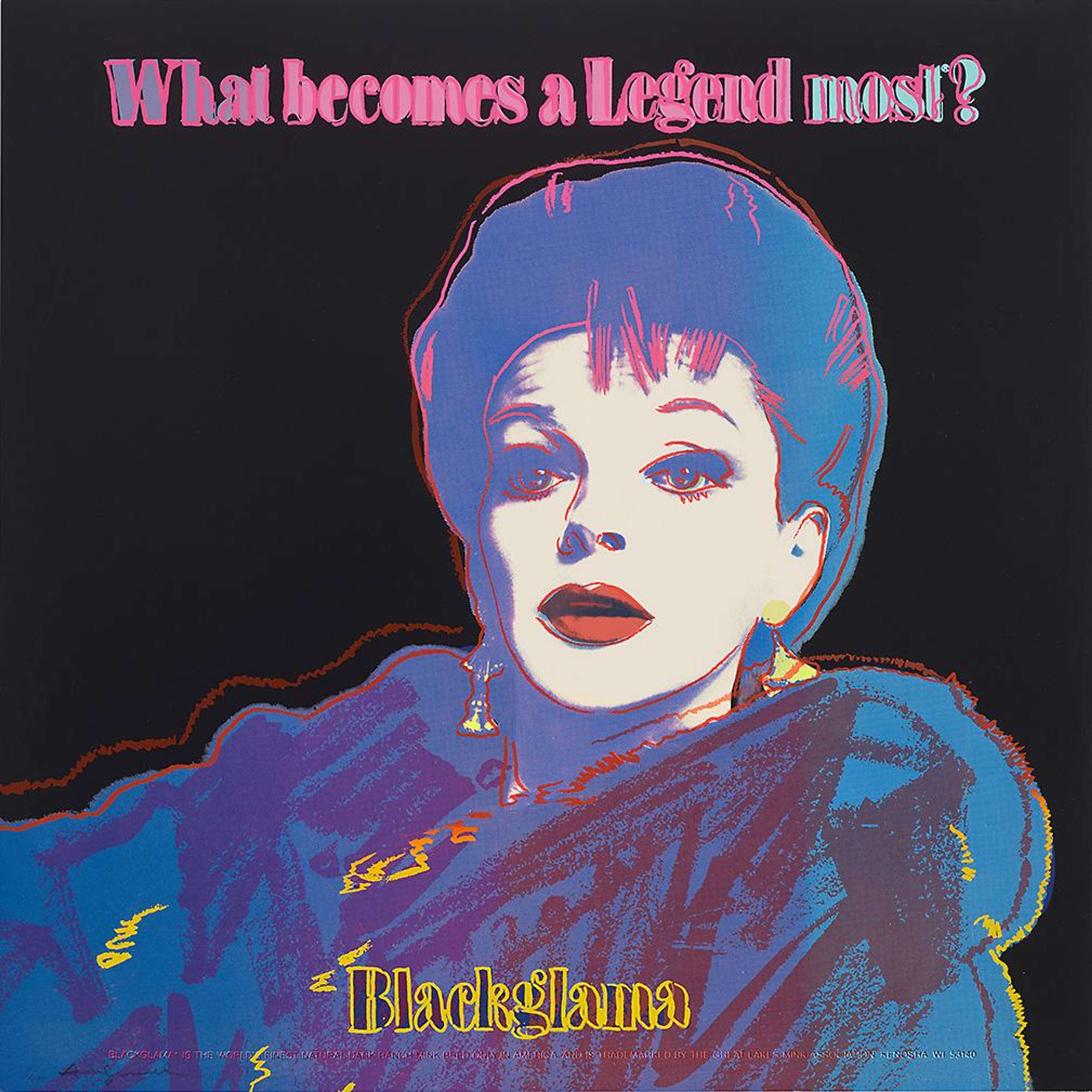 A screenprint by Andy Warhol, titled “Blackglama (Judy Garland) (F. & S. II.351)”, depicting Judy Garland in three-quarter profile against a deep black background. The artwork features her pale illuminated face, cropped dark hair, and vivid blue, pink, and yellow highlights. Executed in Warhol’s Pop Art screen print style, with the print signed.