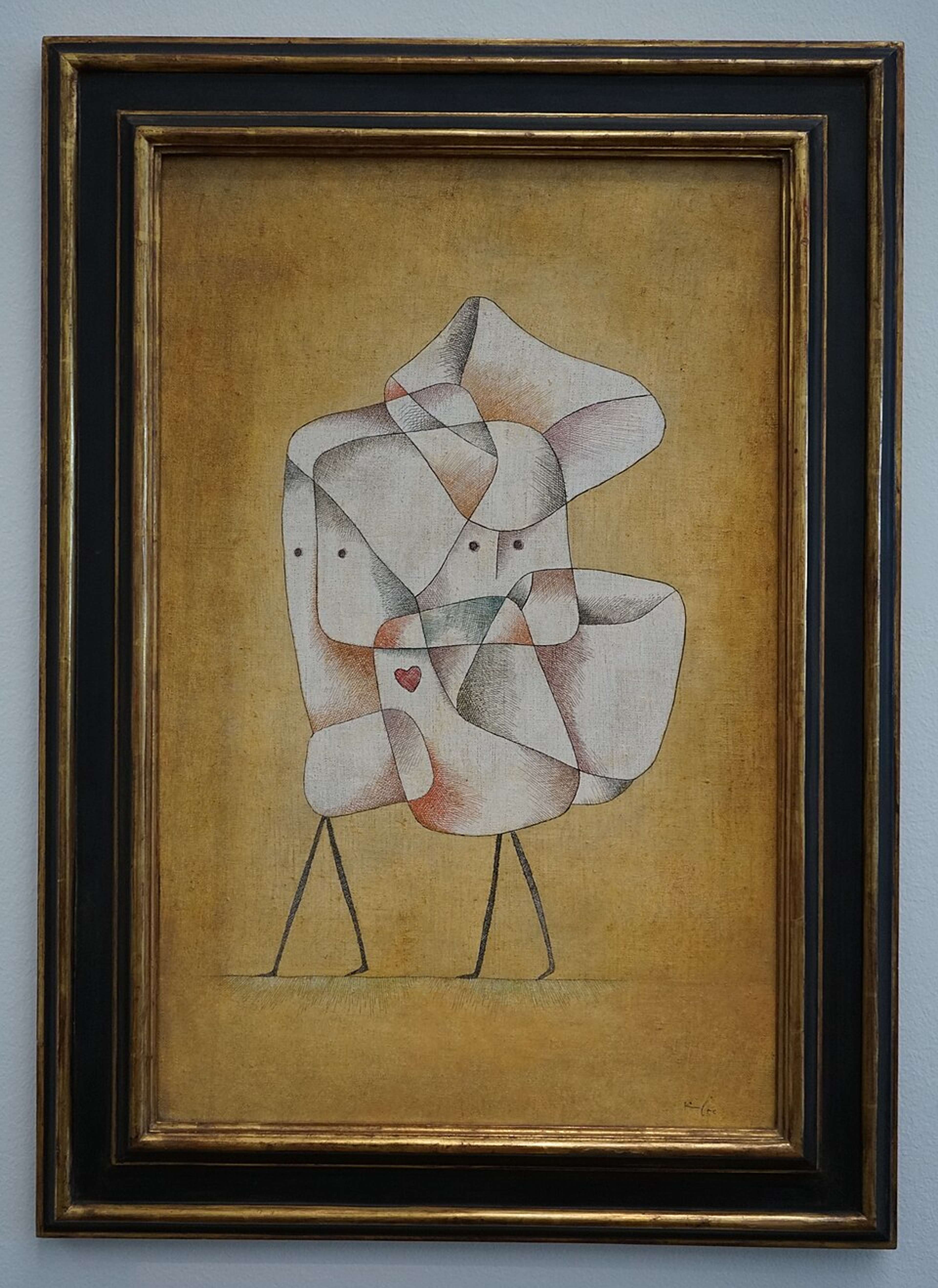 A painting showing two abstract, childlike figures comprising white square or oblong shapes that become pinker, greyer, or more earthy where they overlap. Their legs are denoted by straight black lines, and a small red heart icon is drawn at their shared centre. The figures appear to be embracing.