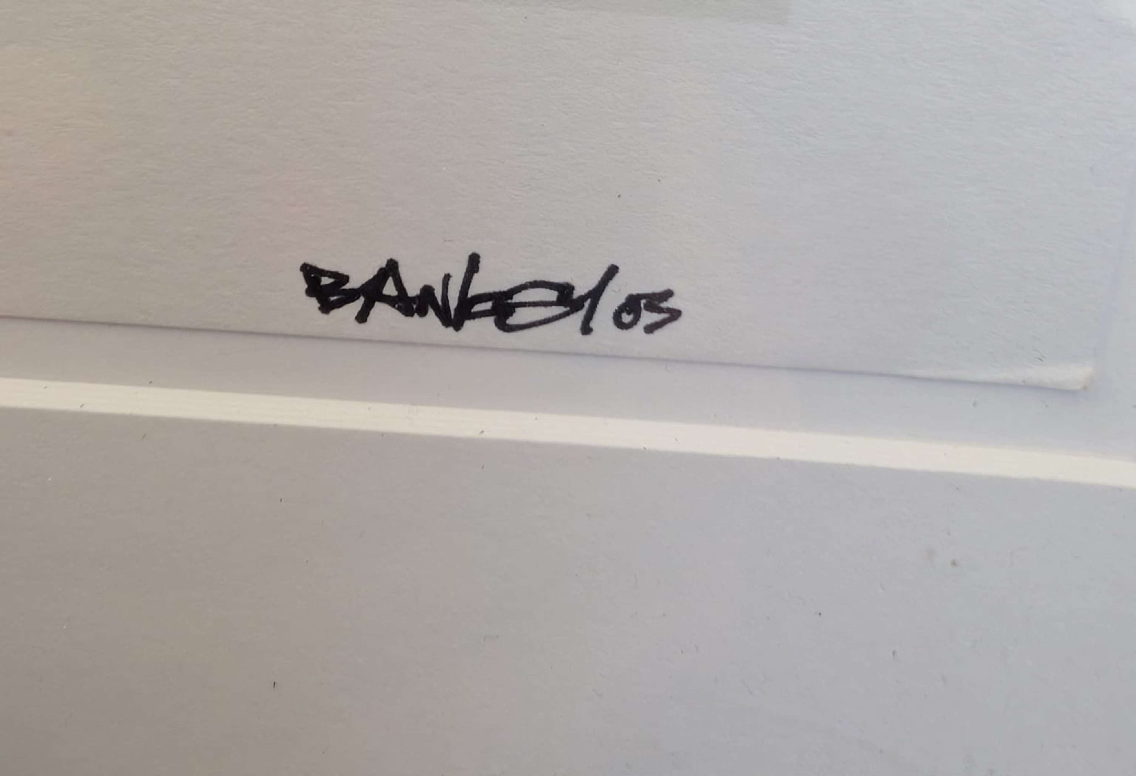 Dry mounting example on Banksy original print 