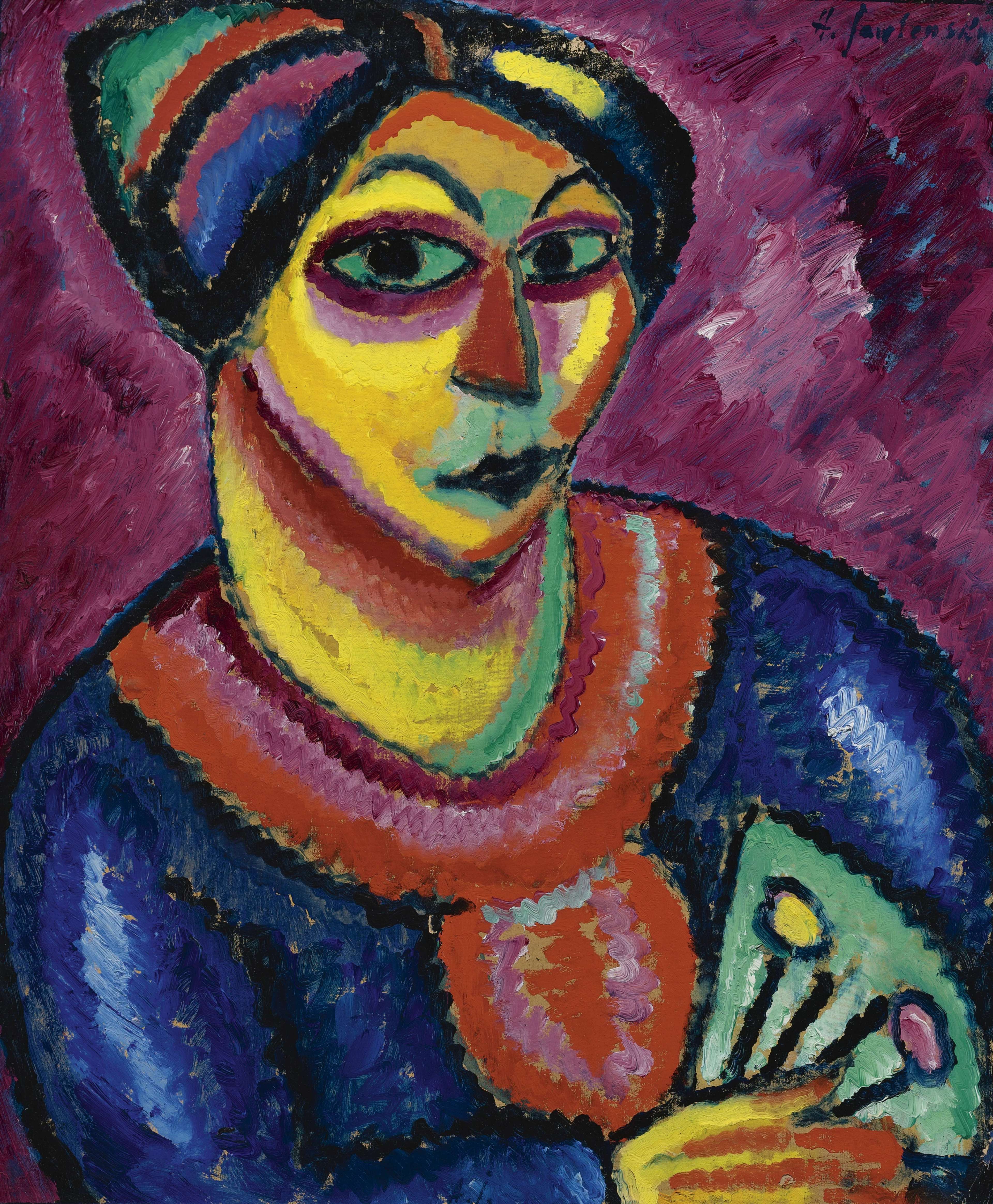  A portrait of a woman holding a green fan. Her facial features are enlarged and simplified, and her face is almost a perfect diamond under her multicoloured headdress. She wears a blue dress with a thick pink neckline. Her skin is mostly yellow, with shadows in green and pink. The style is simplified and expressive, prioritising contrasting colours over realism.