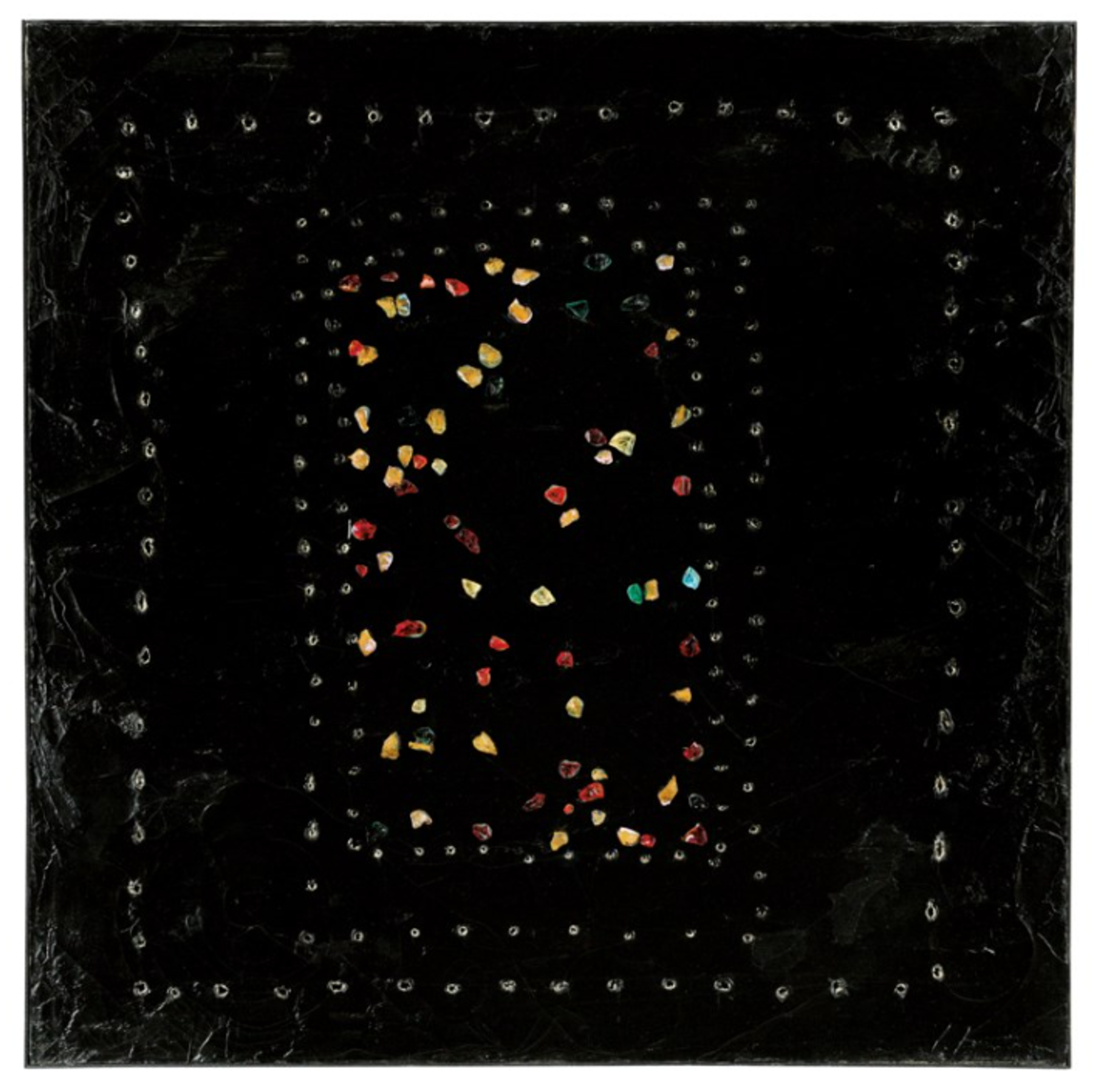 A black square canvas with a border of perforations. Within that border is another rectangular arrangement of perforations. Within that rectangle is a seemingly random arrangement of colourful glass stones. 