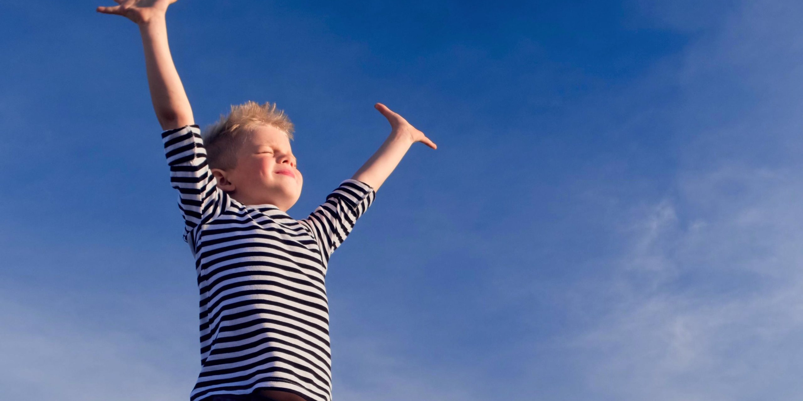 Child breathing easily while playing outdoors with healthy respiratory function