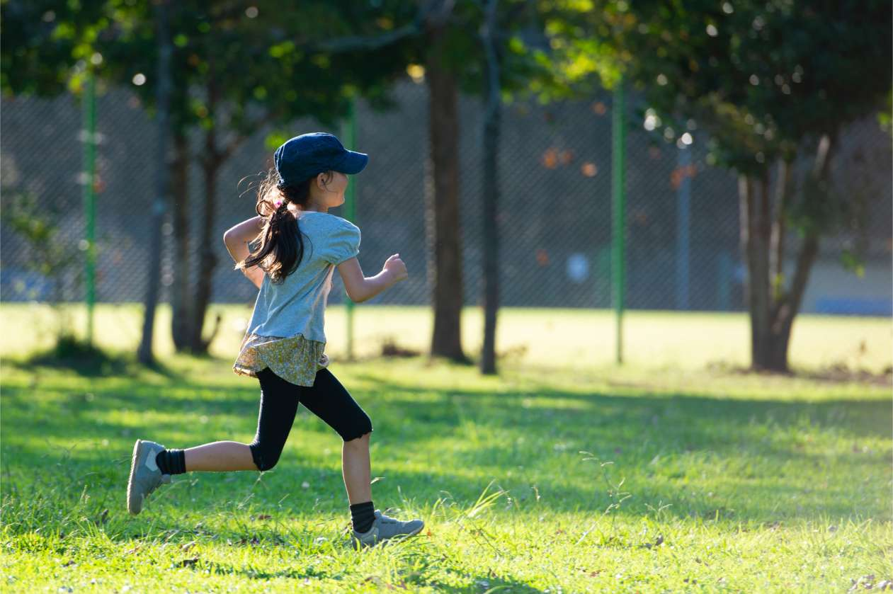 Healthy child playing outdoors, symbolizing strong natural immunity and vitality.